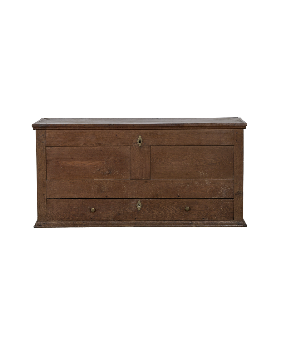 Vintage French oak drawer chest with brass hardware and keyhole detail.