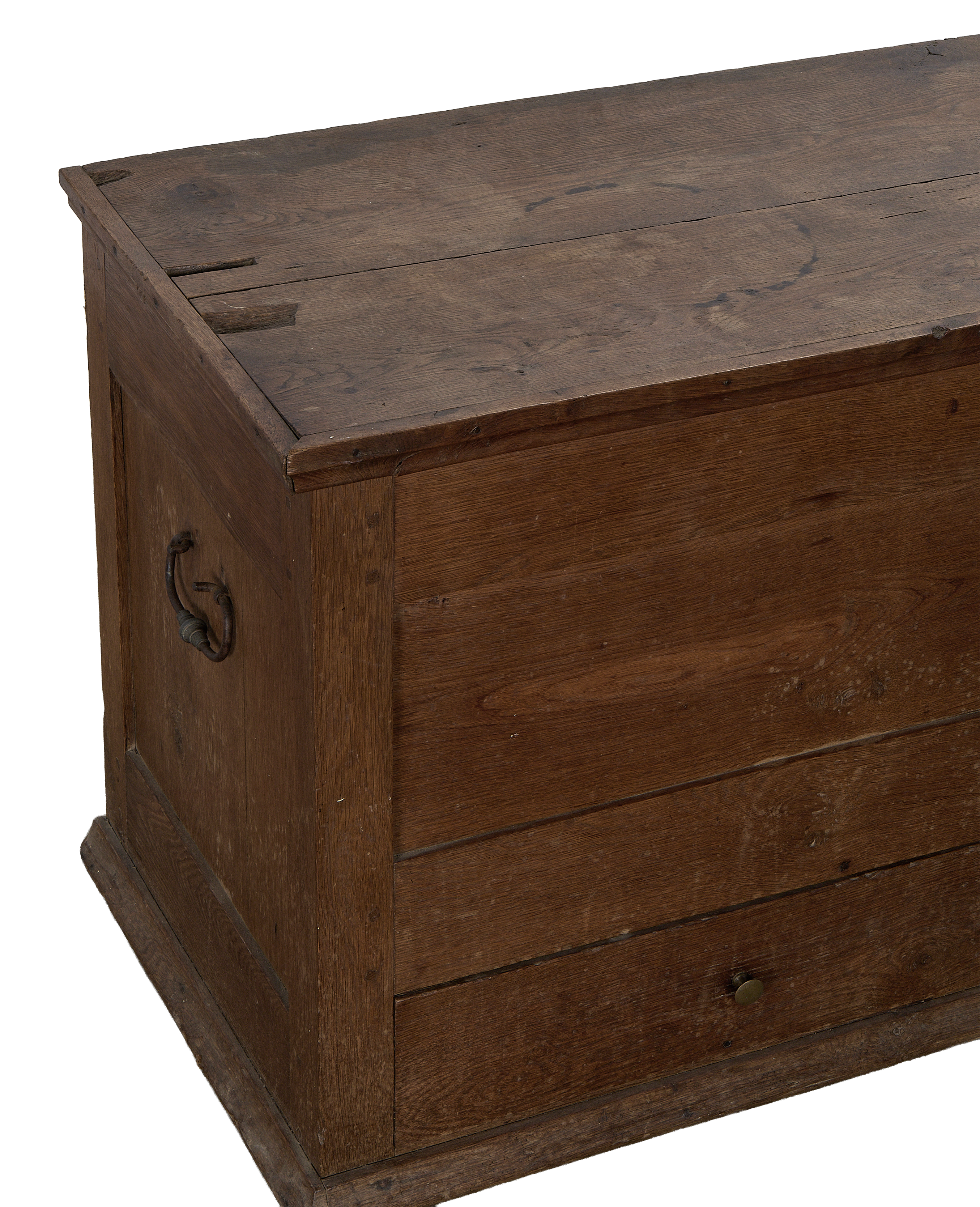 Vintage French oak chest, close up of distressed wooden top, drawer, and antique bronze pull.