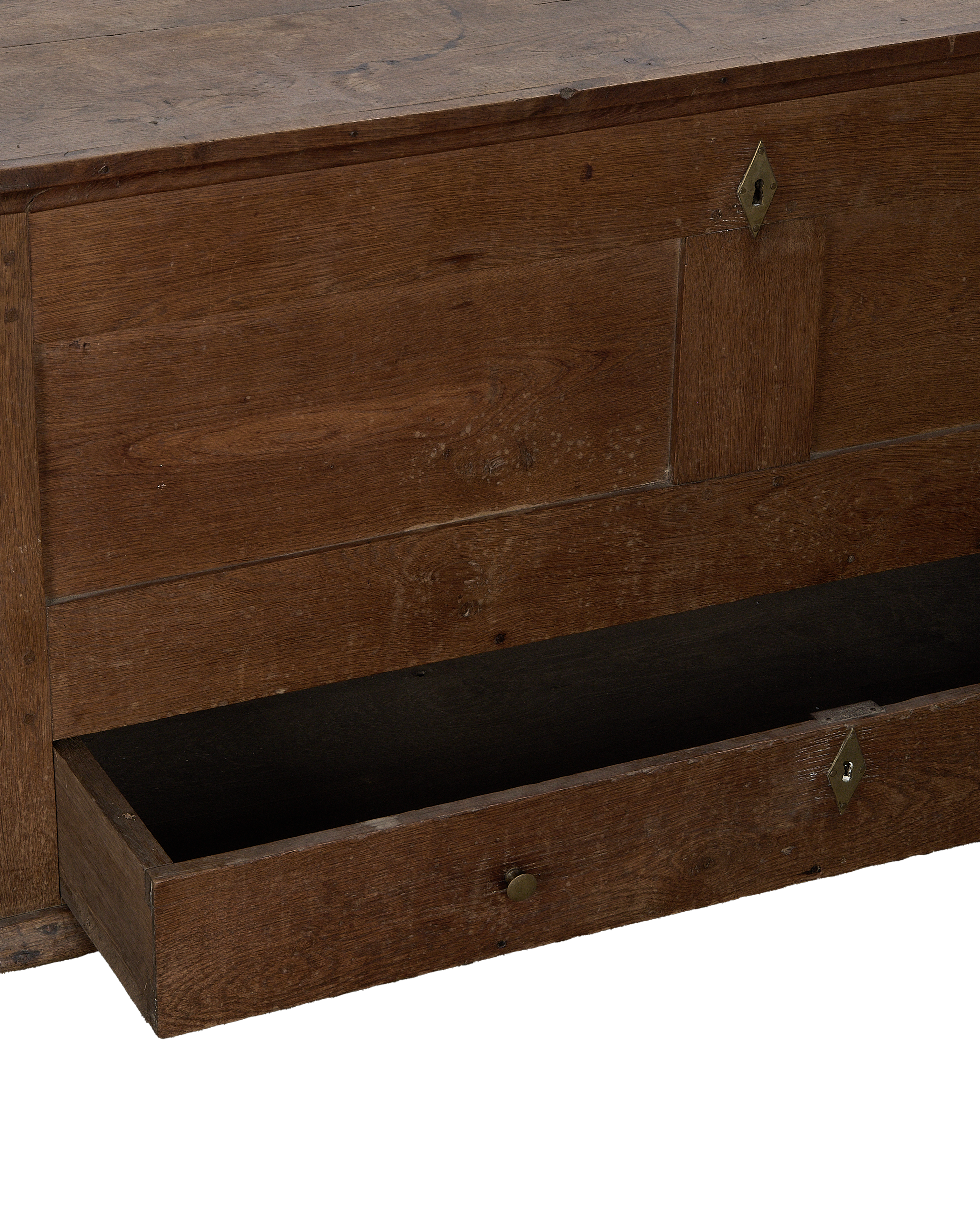 Vintage French oak wood chest with an open bottom drawer and brass keyhole.