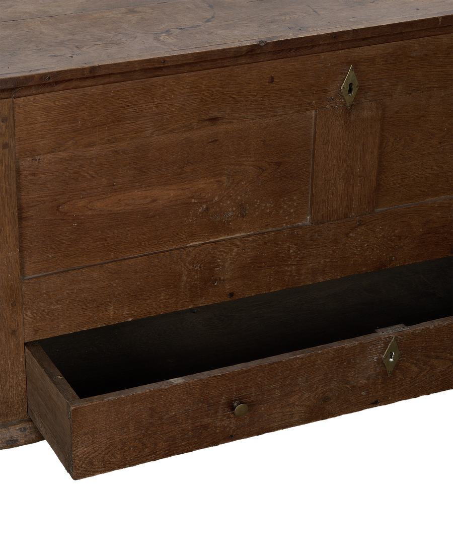 Vintage French oak wood chest with an open bottom drawer and brass keyhole.