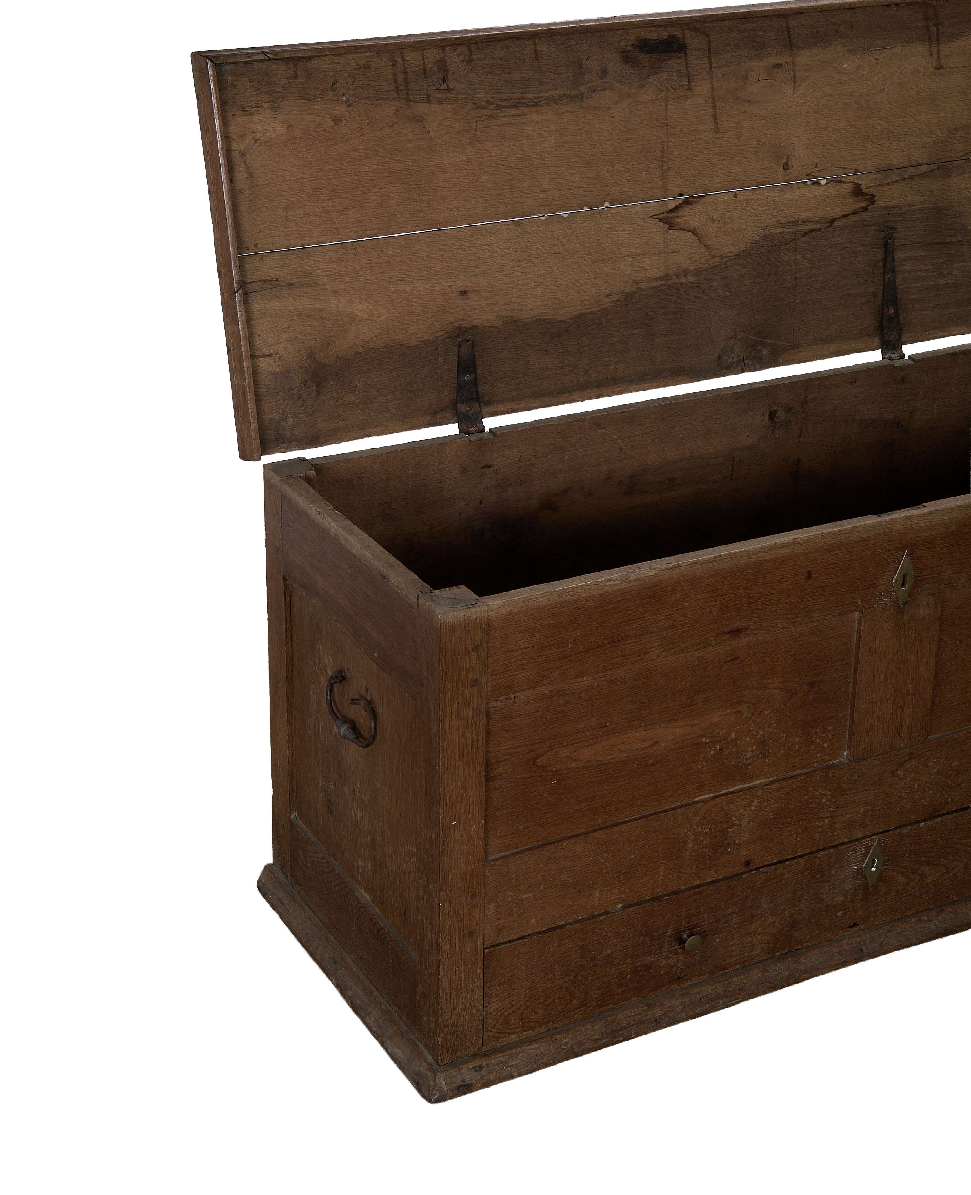 Open lid of vintage French oak chest, showcasing interior storage and sturdy iron hinges.