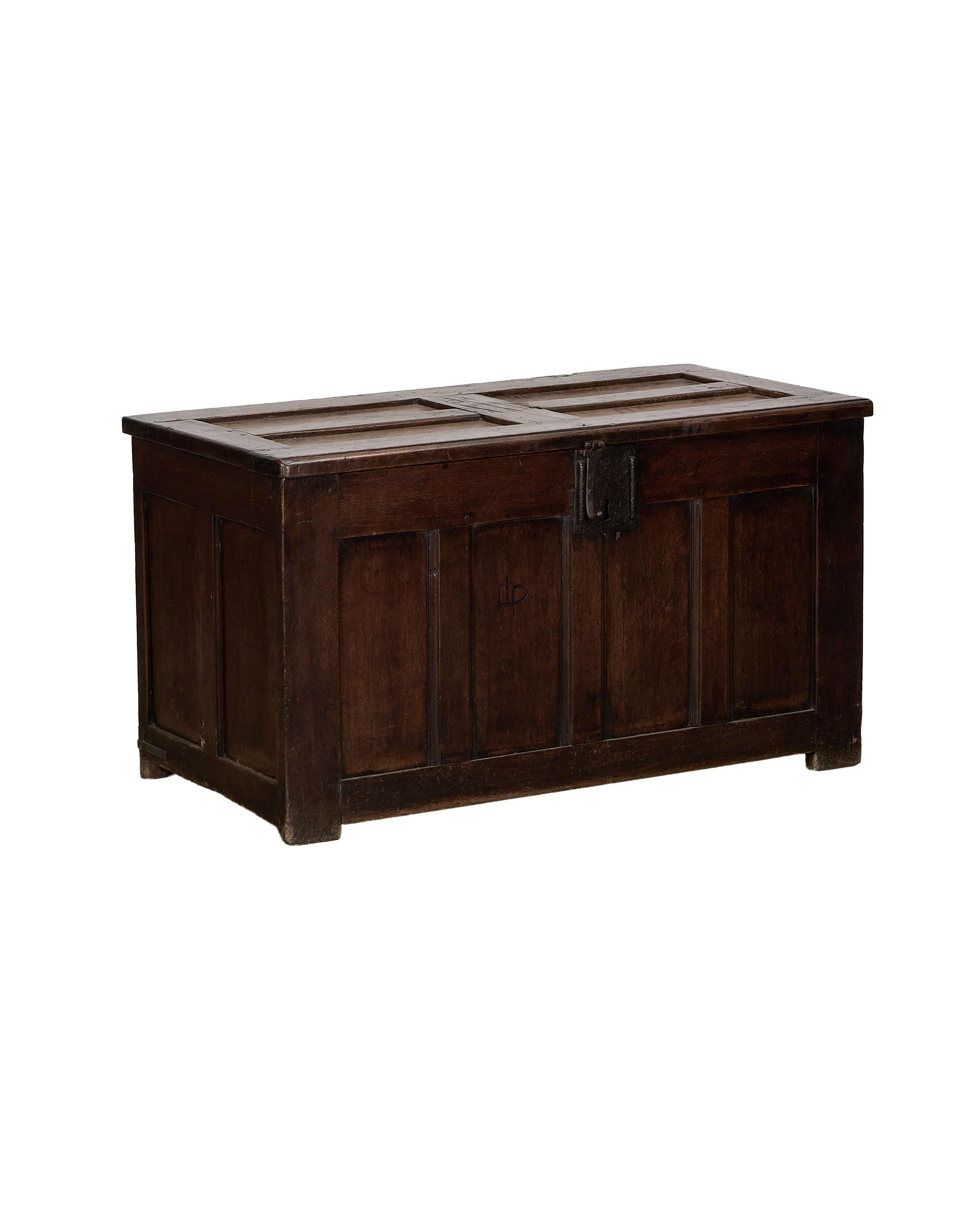 Vintage French oak trunk, front view with detailed paneling and ornate black iron clasp.