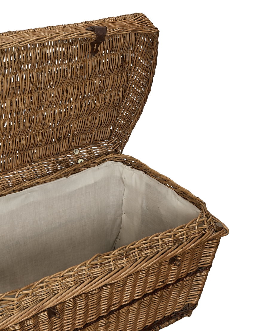 Vintage French wicker rectangular storage chest with open lid, showing off the clean white fabric lining.