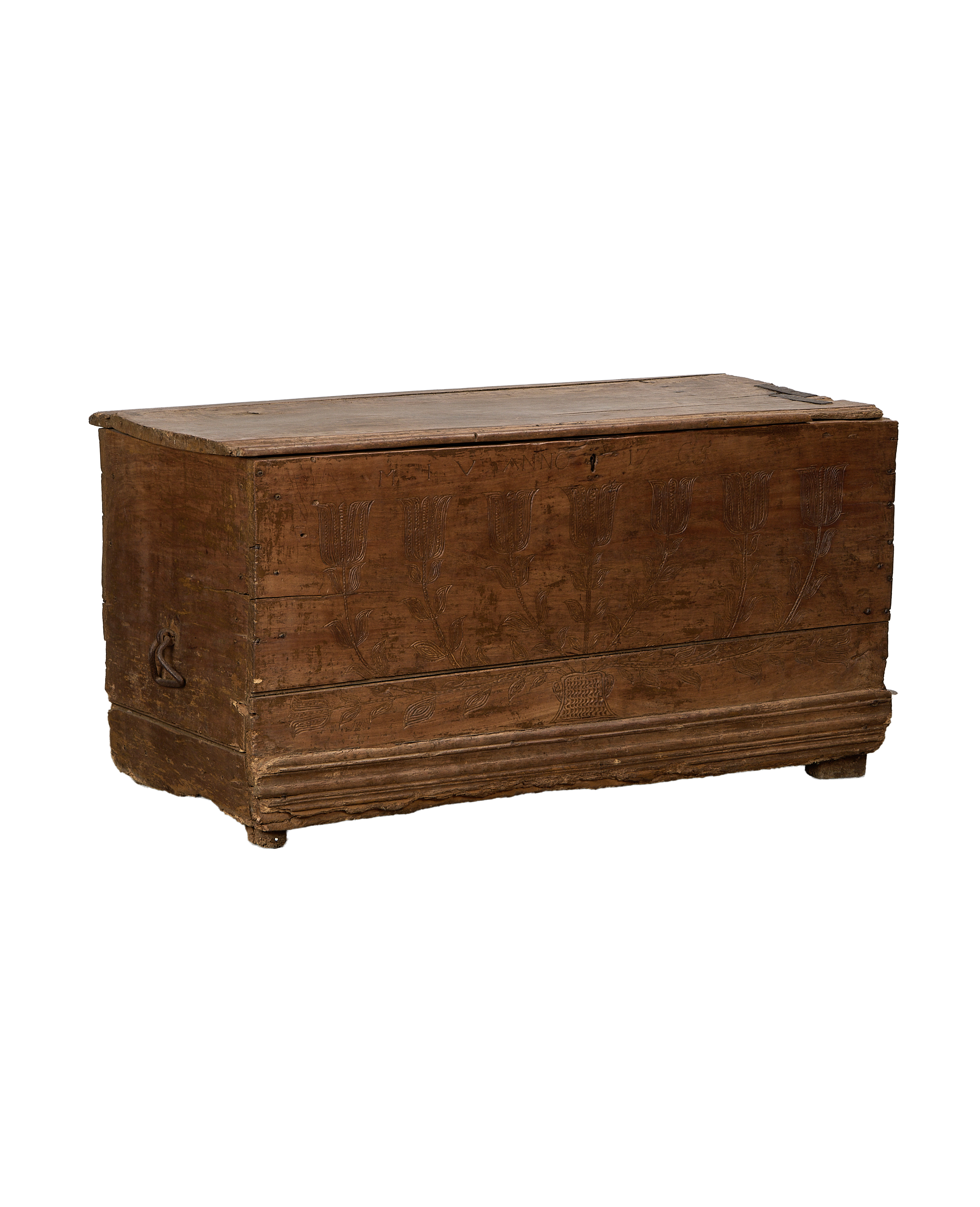 Vintage French oak chest with intricate hand-carved floral tulip designs on front panel.