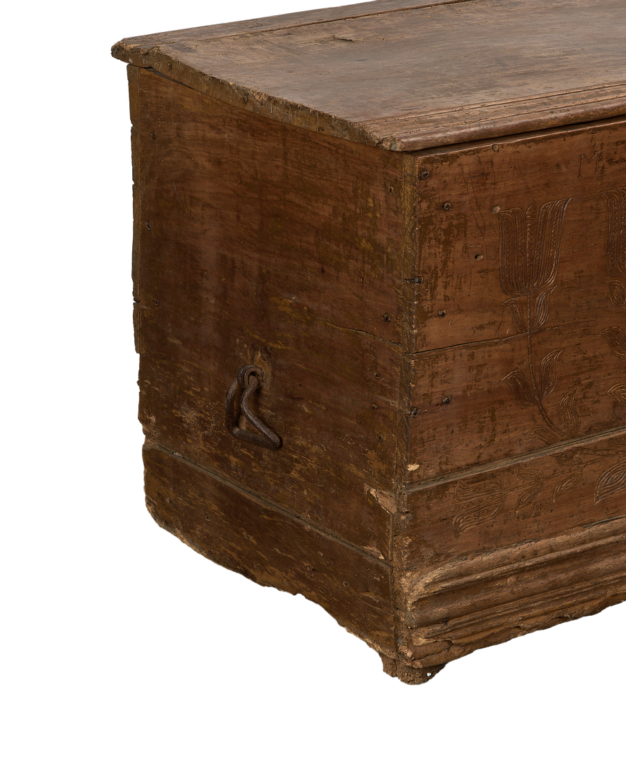 Vintage French oak chest, closed lid detail, with aged patina and carved floral motif.