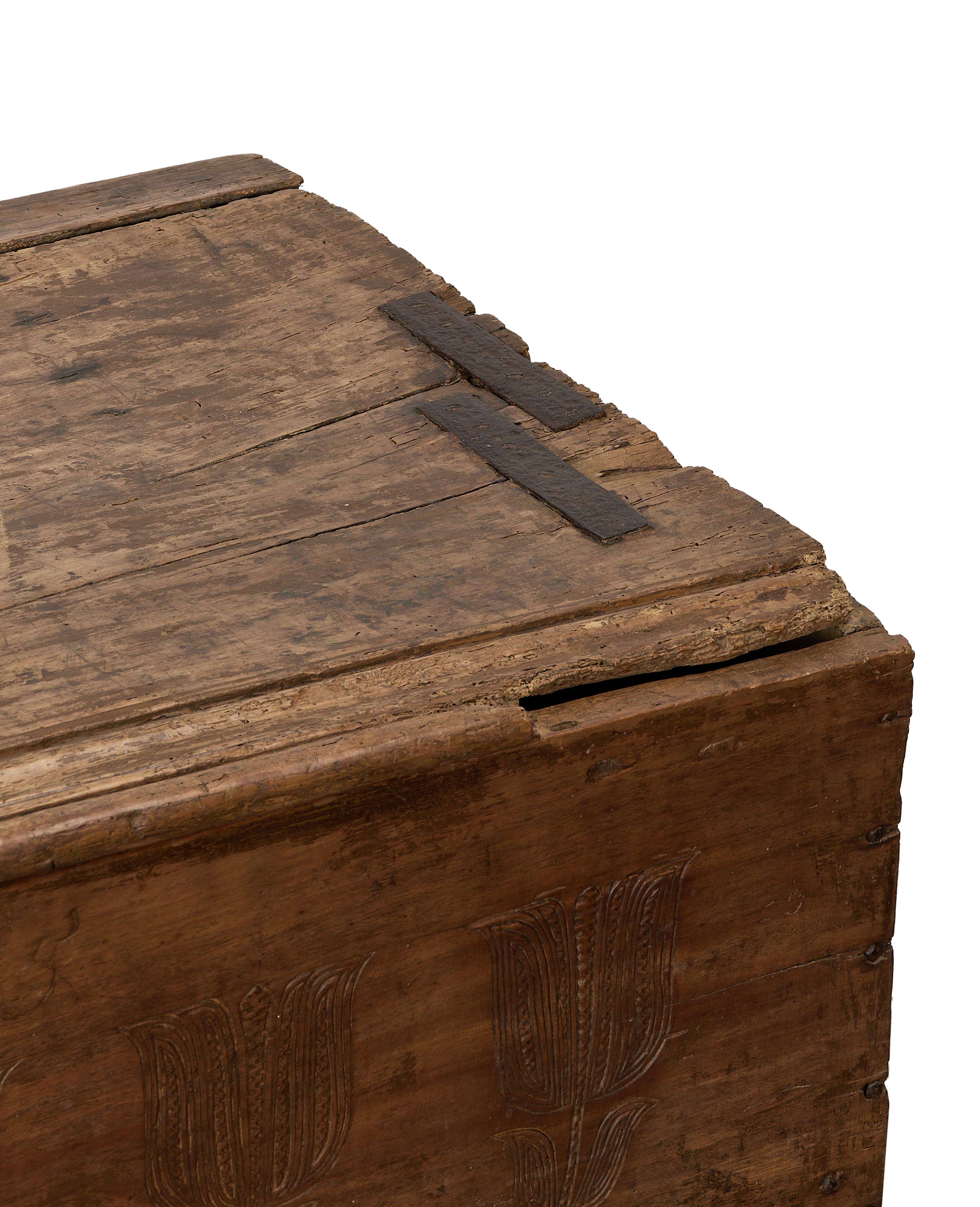 Close-up of vintage French oak chest top, showing antique iron straps and rough aged texture.
