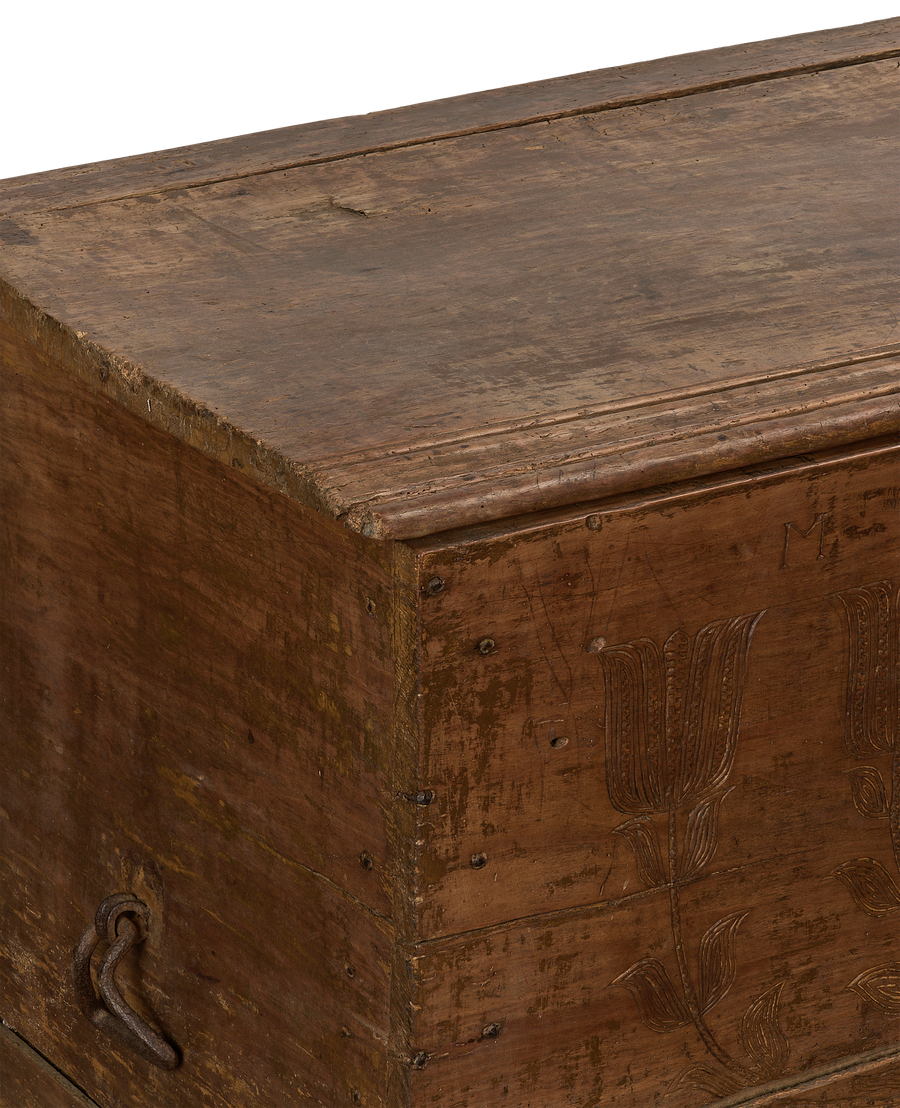 Vintage French oak chest showing original rustic wood grain and floral carving detail.