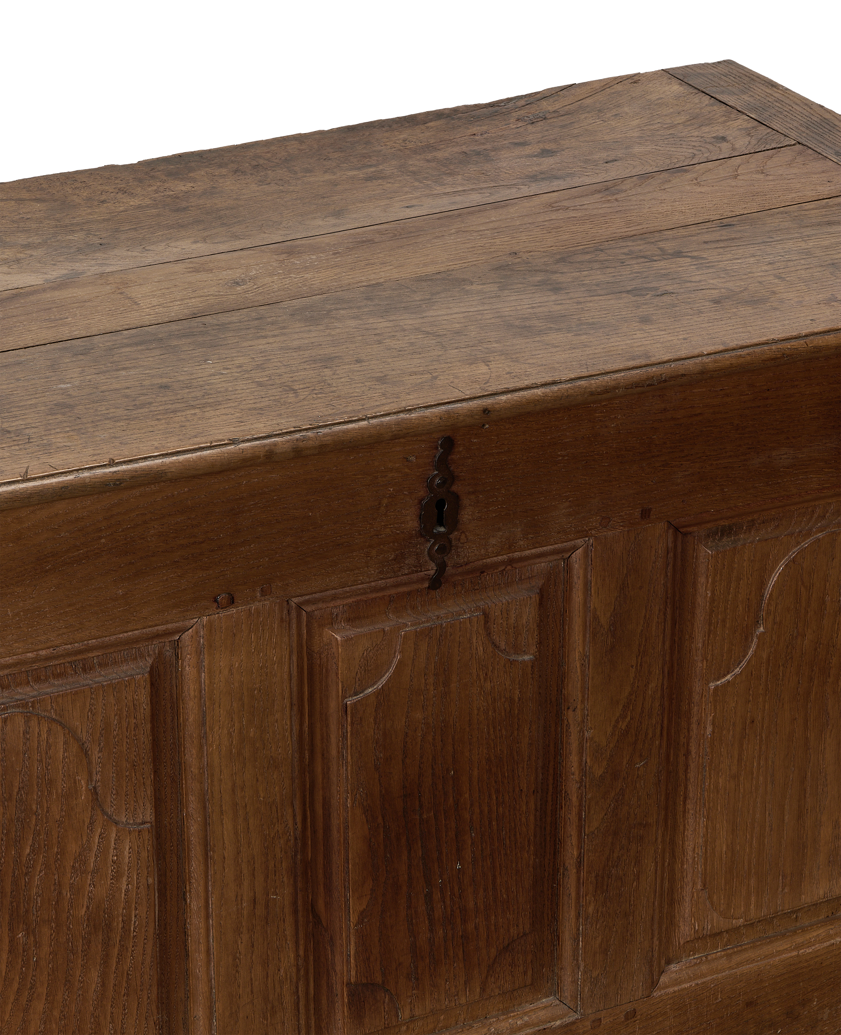 Vintage French oak blanket chest, close-up of worn top surface and ornate key plate.