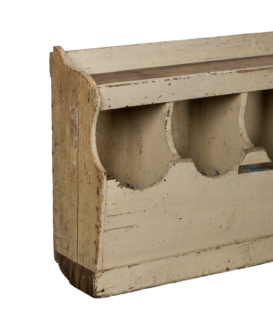 Close-up of vintage French farmhouse oak grain bins, showcasing detailed curved compartments.