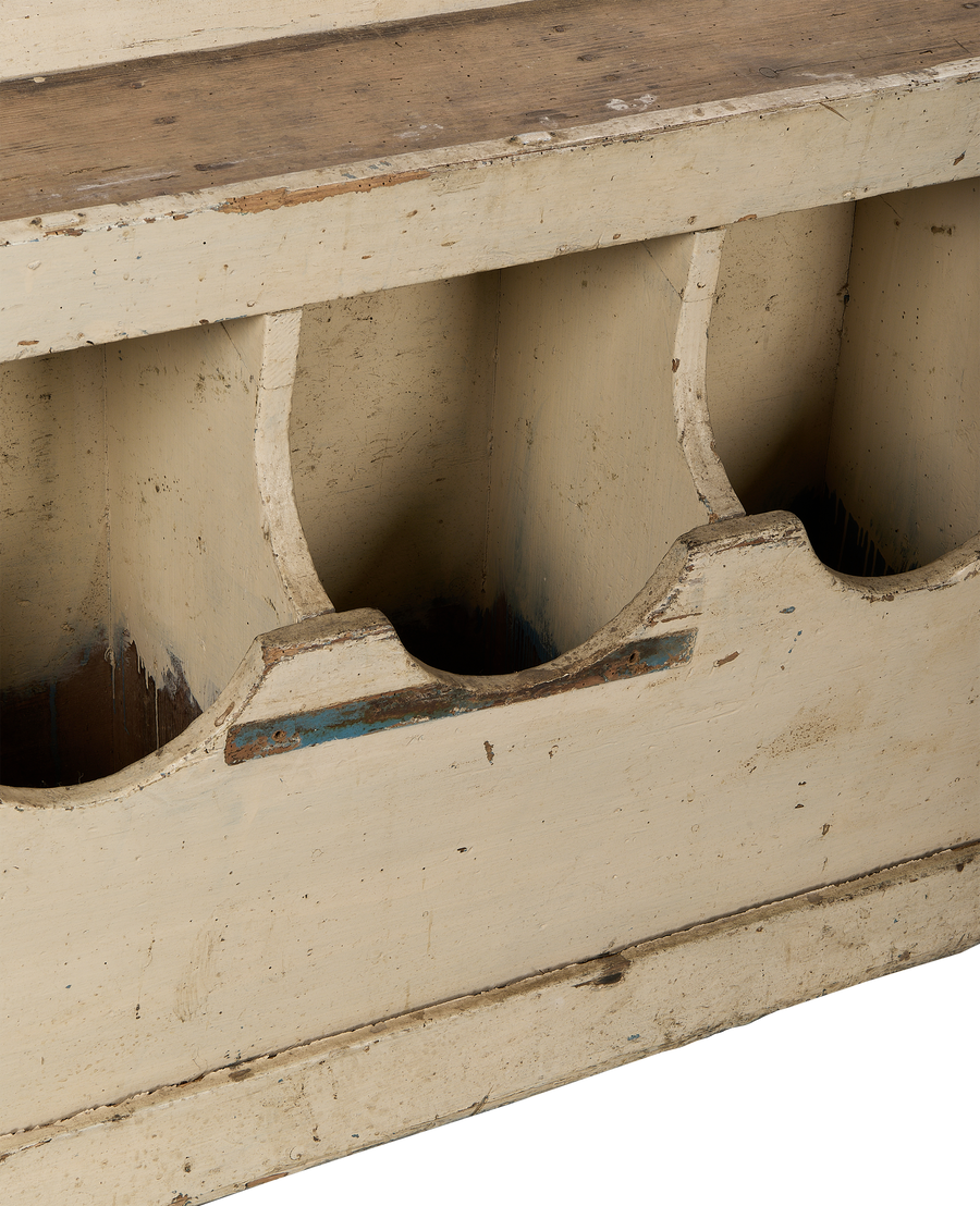 Close-up of vintage French farmhouse oak grain bins, distressed cream paint, and interior view of individual hoppers.