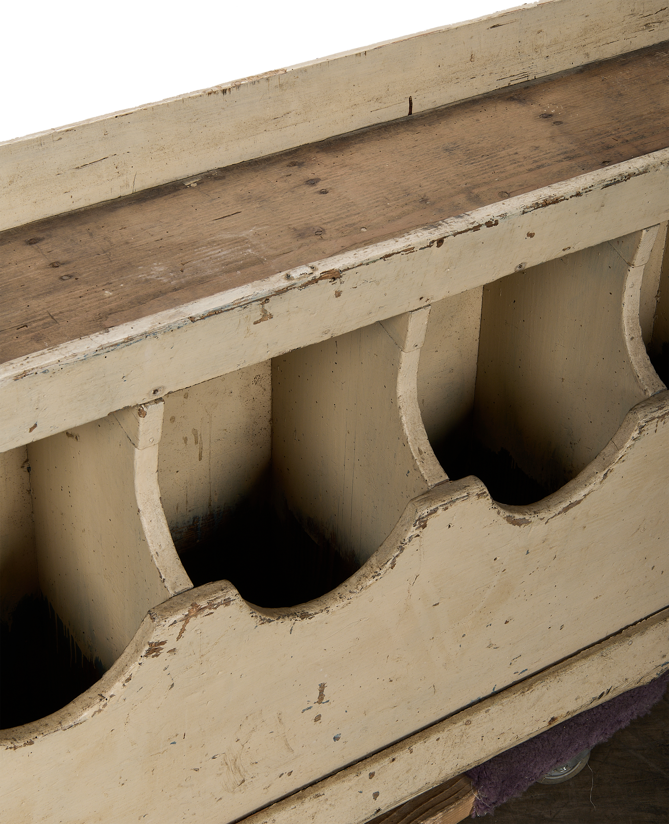 Close-up, distressed paint and aged oak grain bins, showcasing vintage French farmhouse charm.