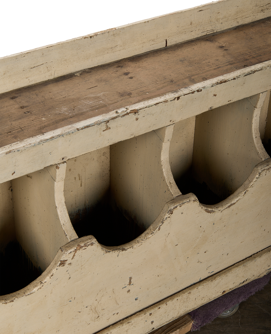Close-up, distressed paint and aged oak grain bins, showcasing vintage French farmhouse charm.