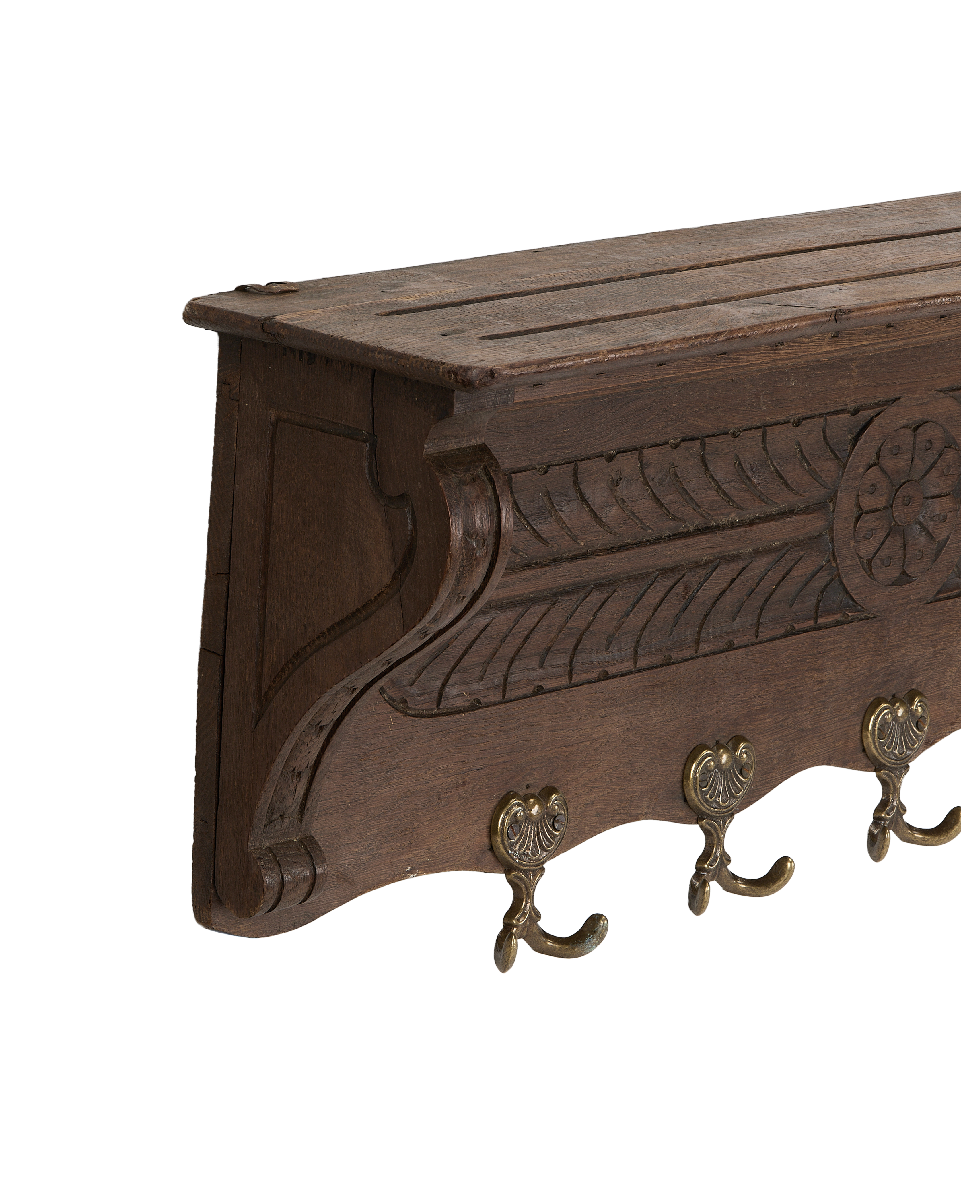 Vintage French oak hanging shelf, close-up showing ornate carved details and aged brass hooks.