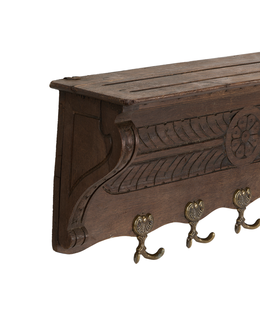Vintage French oak hanging shelf, close-up showing ornate carved details and aged brass hooks.