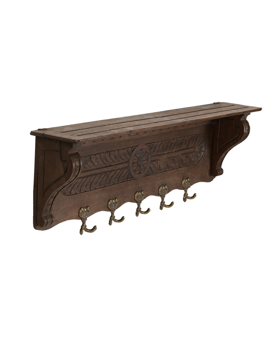Vintage French Oak hanging shelf, showing carved panels, distressed wood top, and ornate brass hooks.