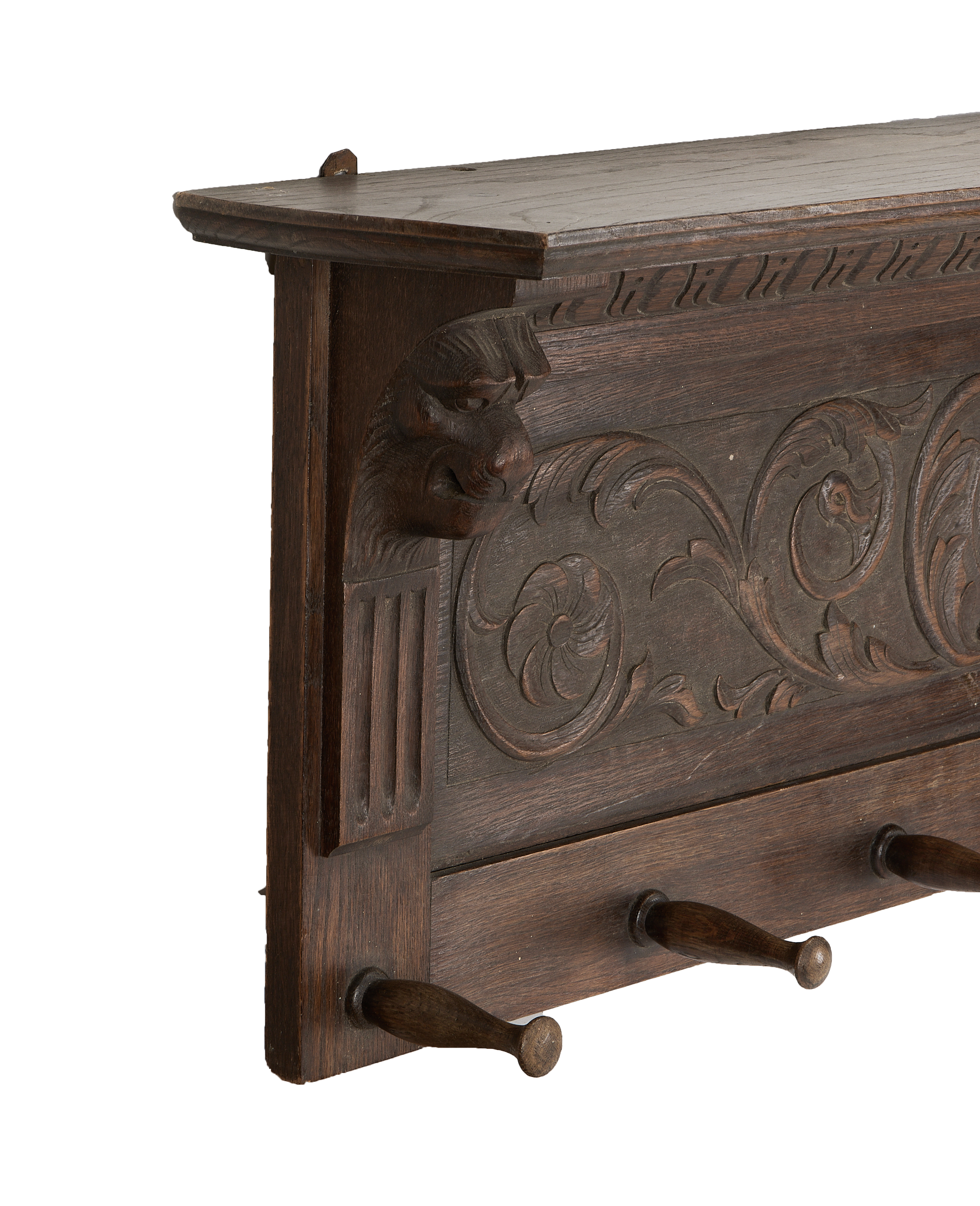 Vintage French oak hanging shelf, detail of carved grotesque mask and acanthus leaf.