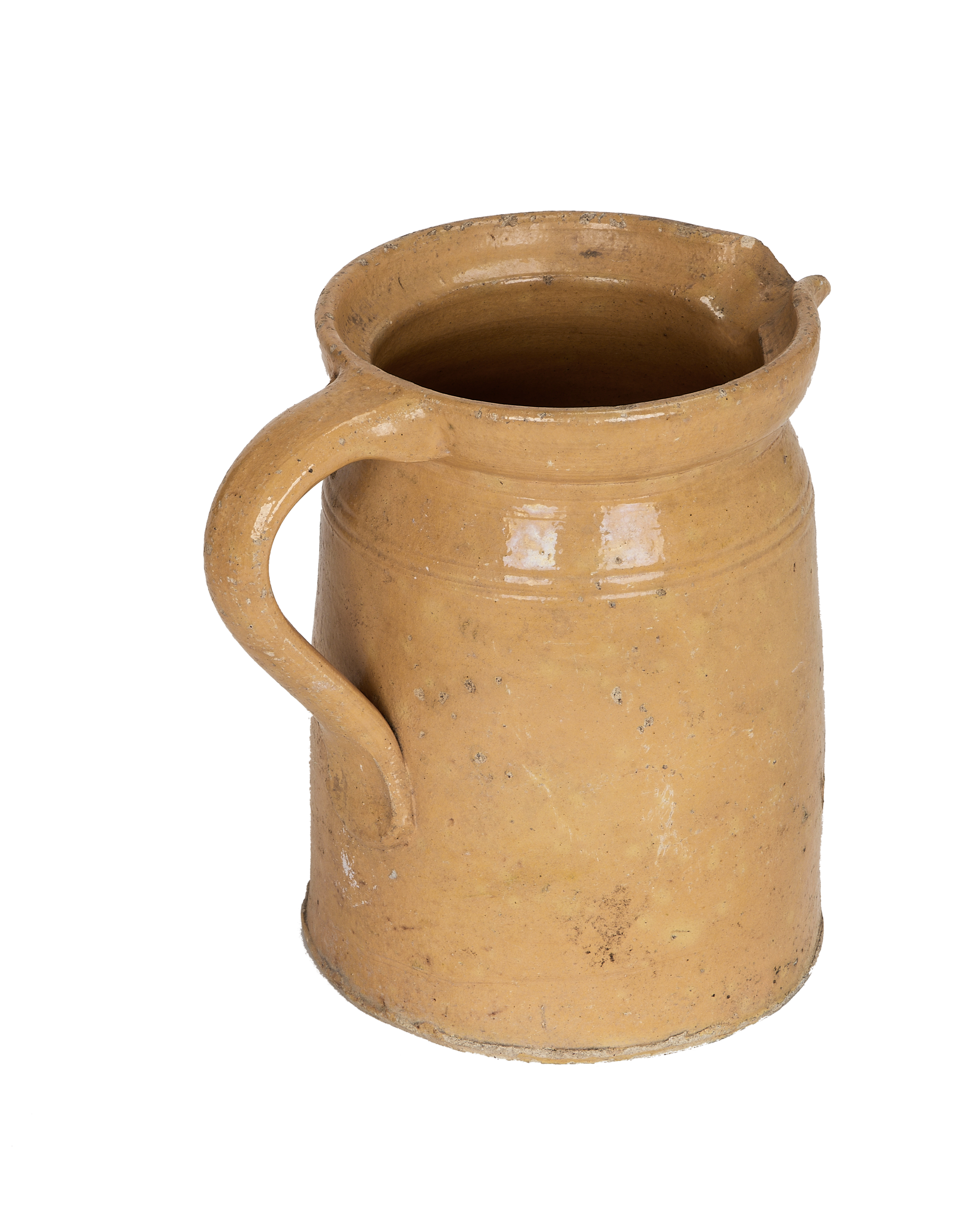 Vintage French mustard Alsace glazed pitcher, top-down view showing interior and spout detail.