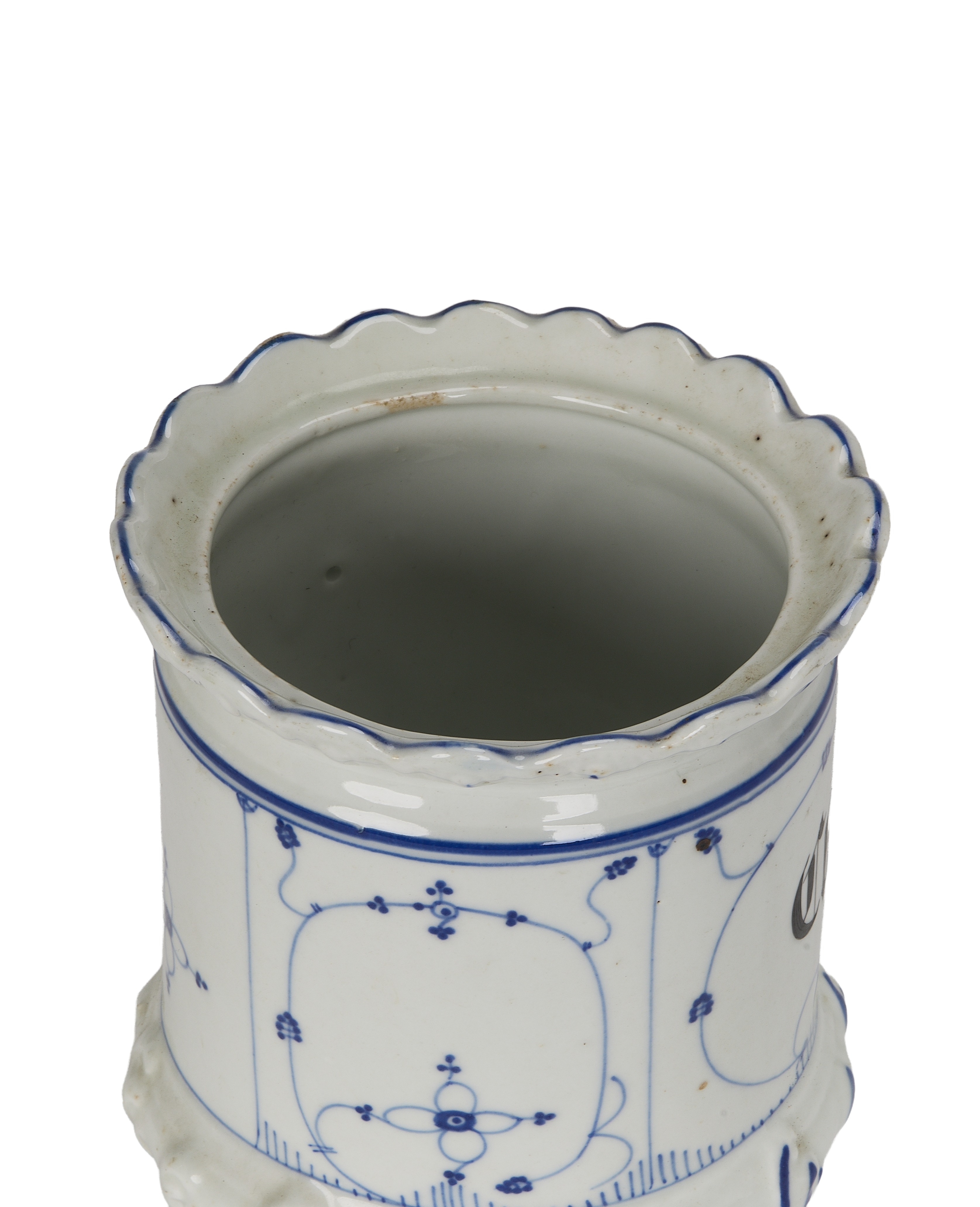 Vintage French ceramic spice jar, close-up top view, showing scalloped rim and interior.