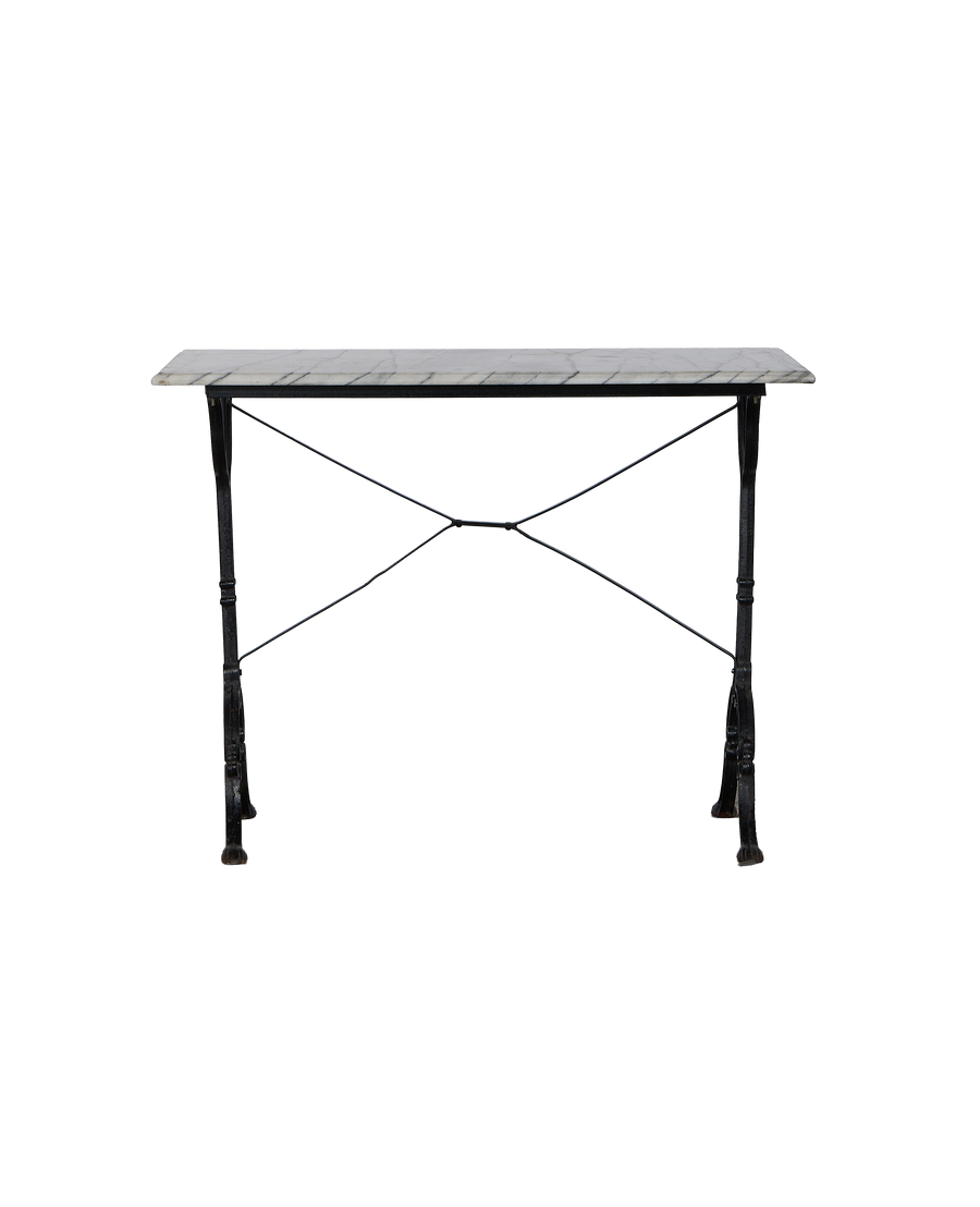 Vintage French marble bistro table featuring a weathered black iron x-frame base.