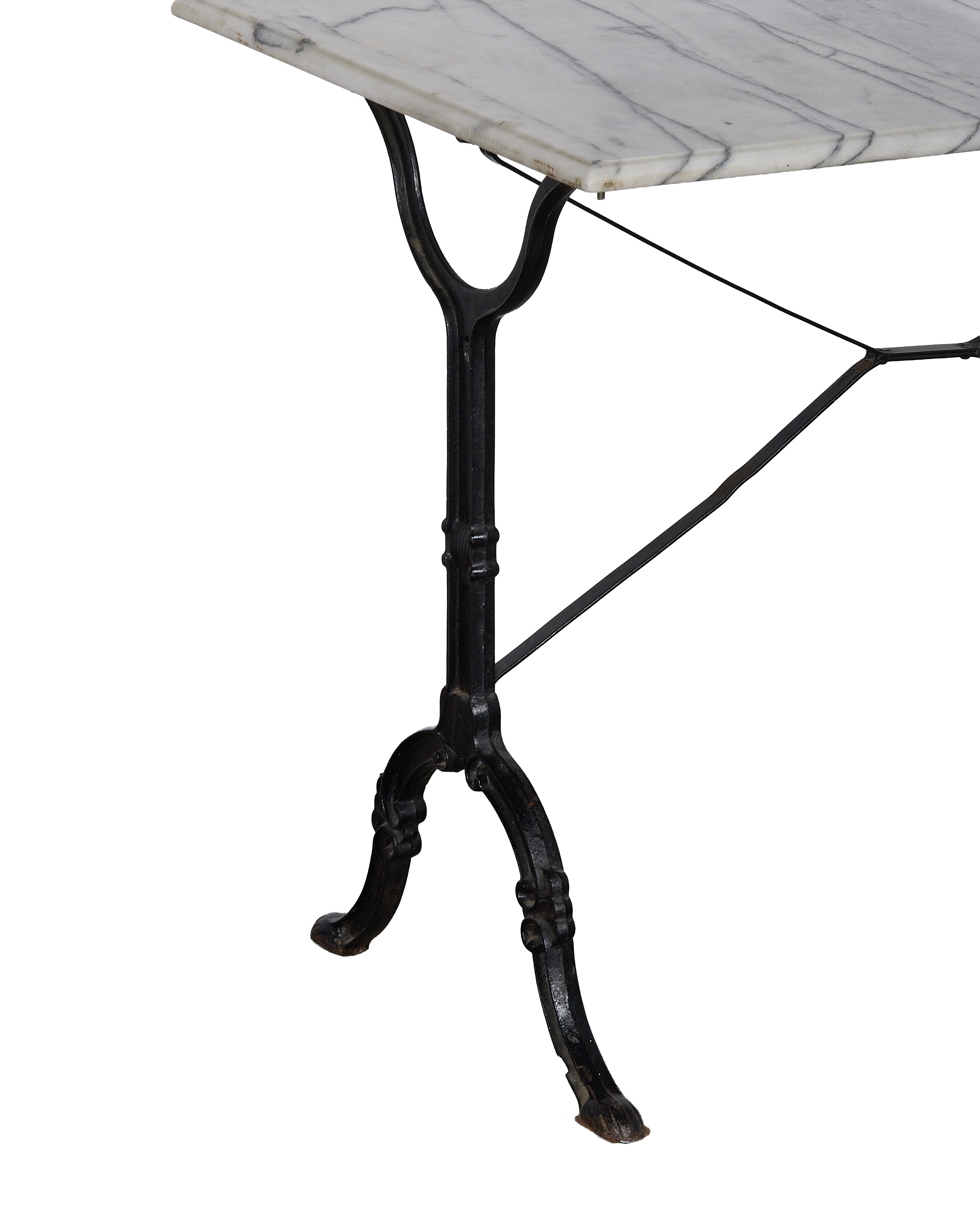 Vintage French marble bistro table with ornate black cast iron base, side view.