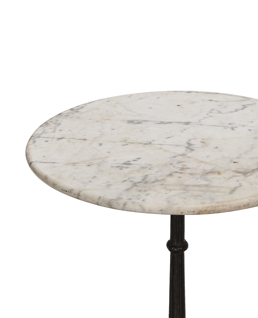 Vintage French marble bistro table, showing detailed veining and weathered patina on tabletop.