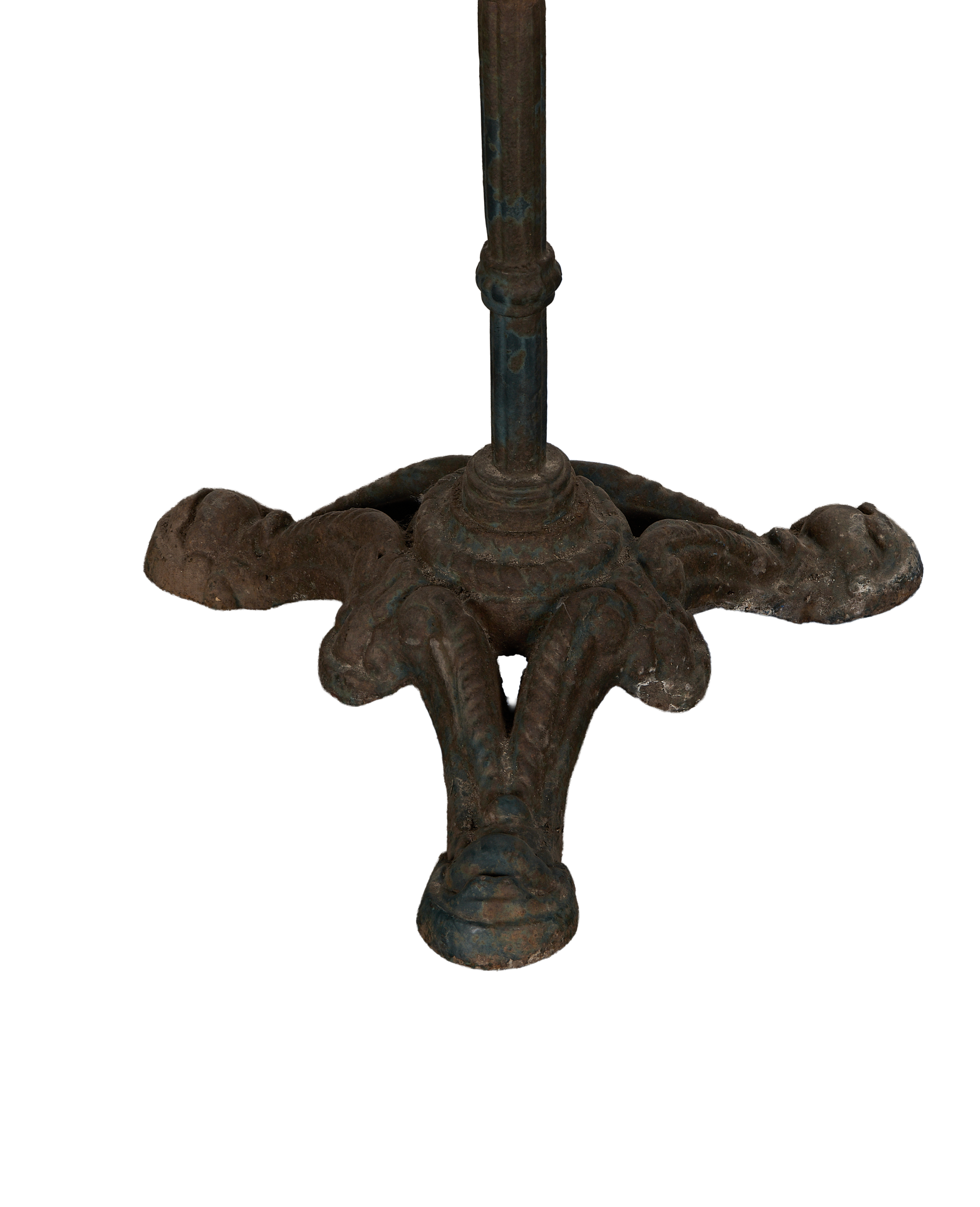 Vintage French cast iron bistro table base with ornate feet, distressed blue-brown patina.