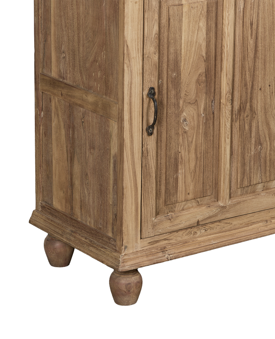 Vintage bleached oak cabinet from India, showing ornate turned feet and distressed wood grain.