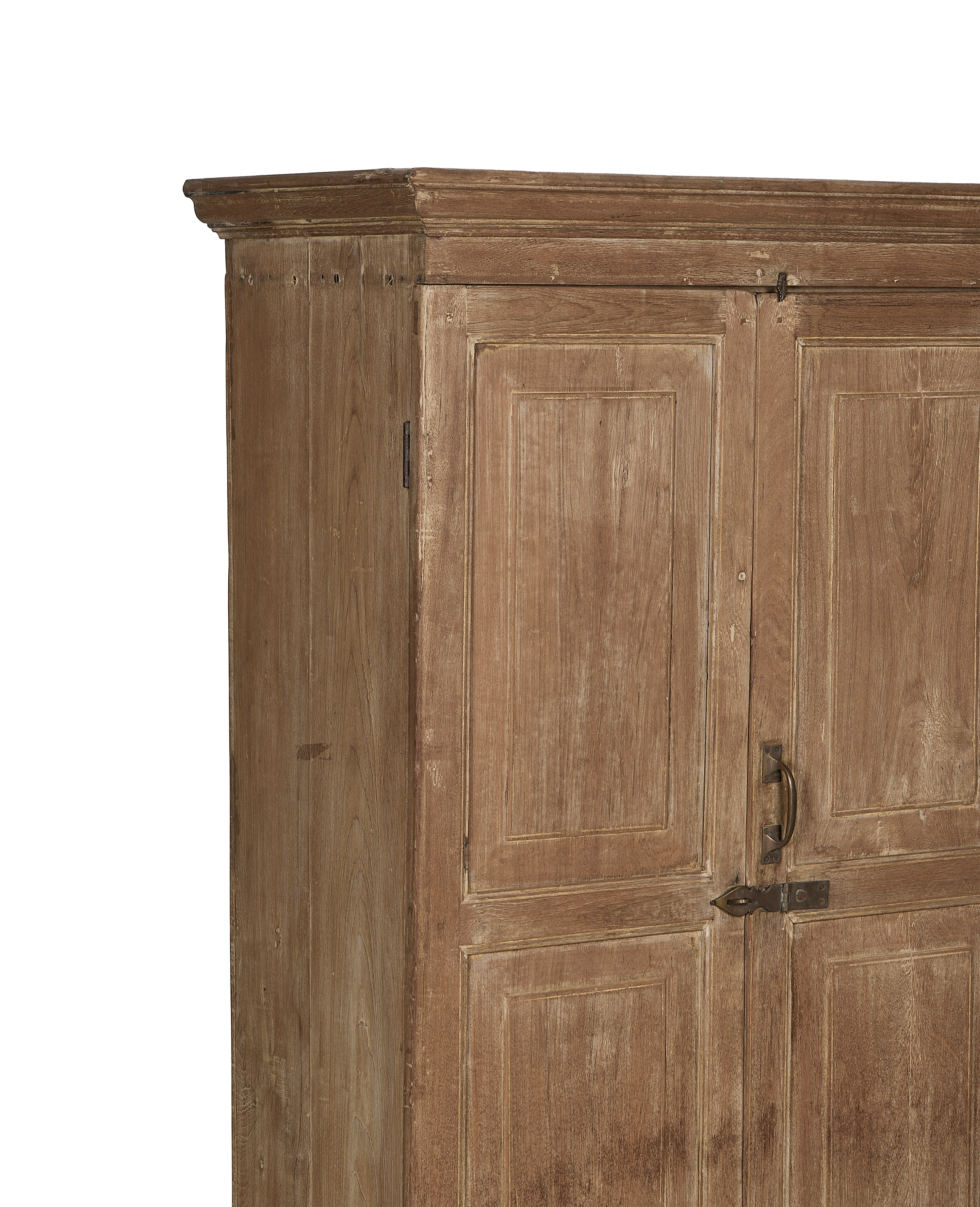 Right side of vintage bleached oak cabinet from India, showing paneled doors and brass latches.