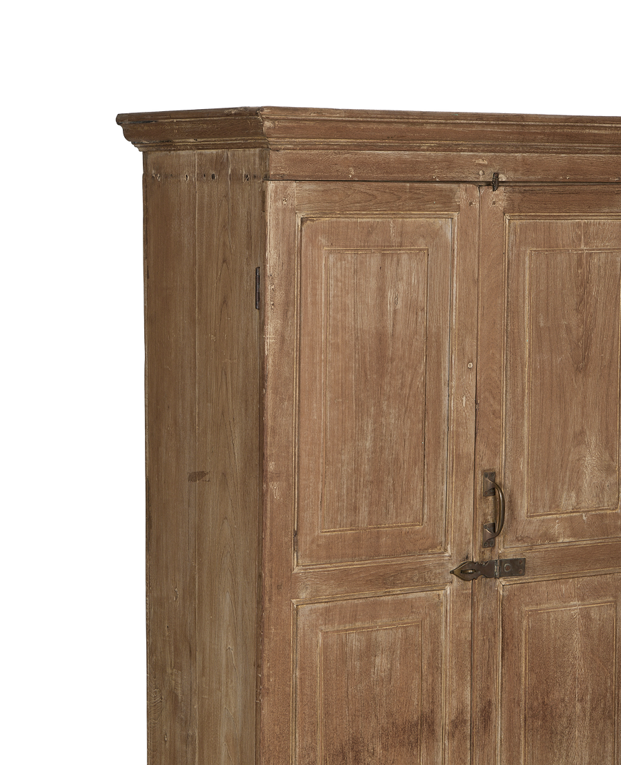 Right side of vintage bleached oak cabinet from India, showing paneled doors and brass latches.