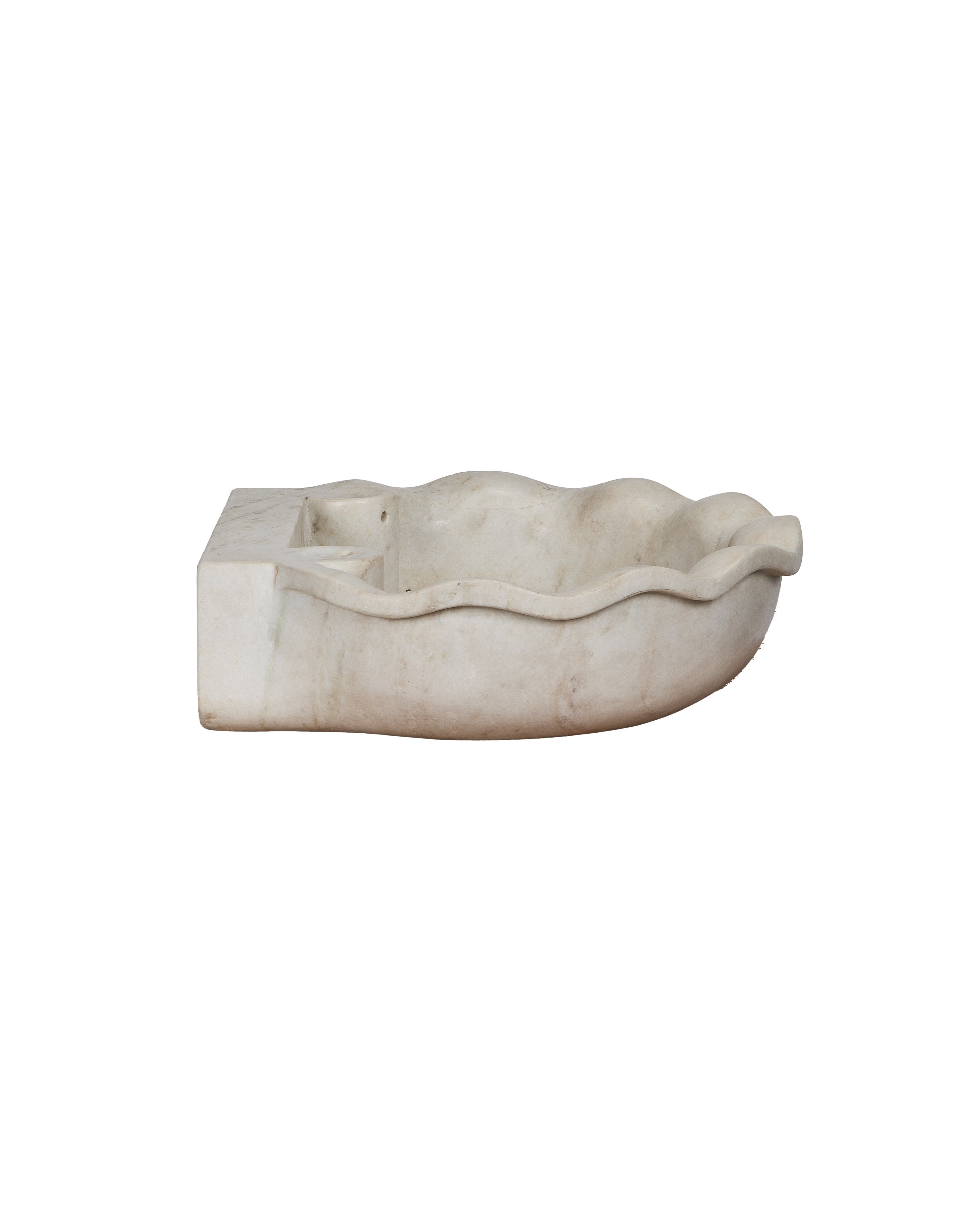 Reproduction Indian marble sink, side view, showing wavy edges and rectangular back.