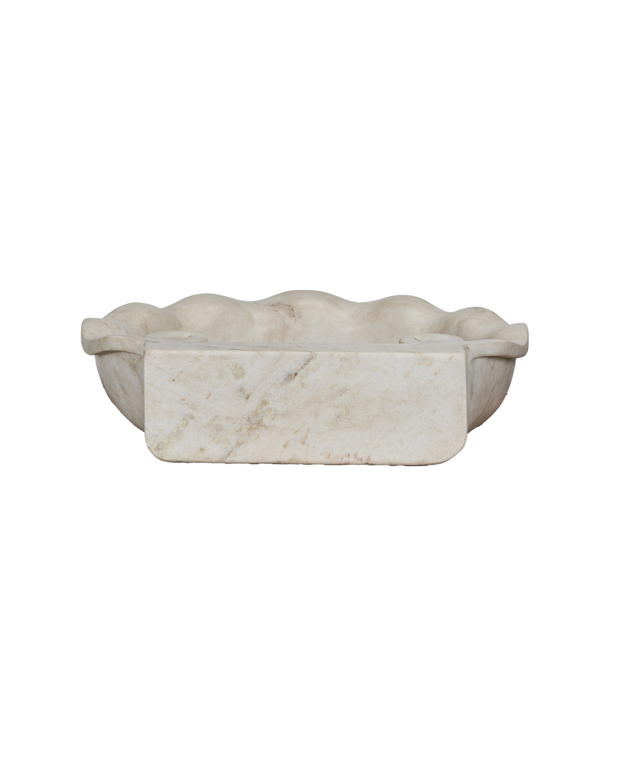 Cream marble reproduction sink, showing front view of curved basin and soap holder.
