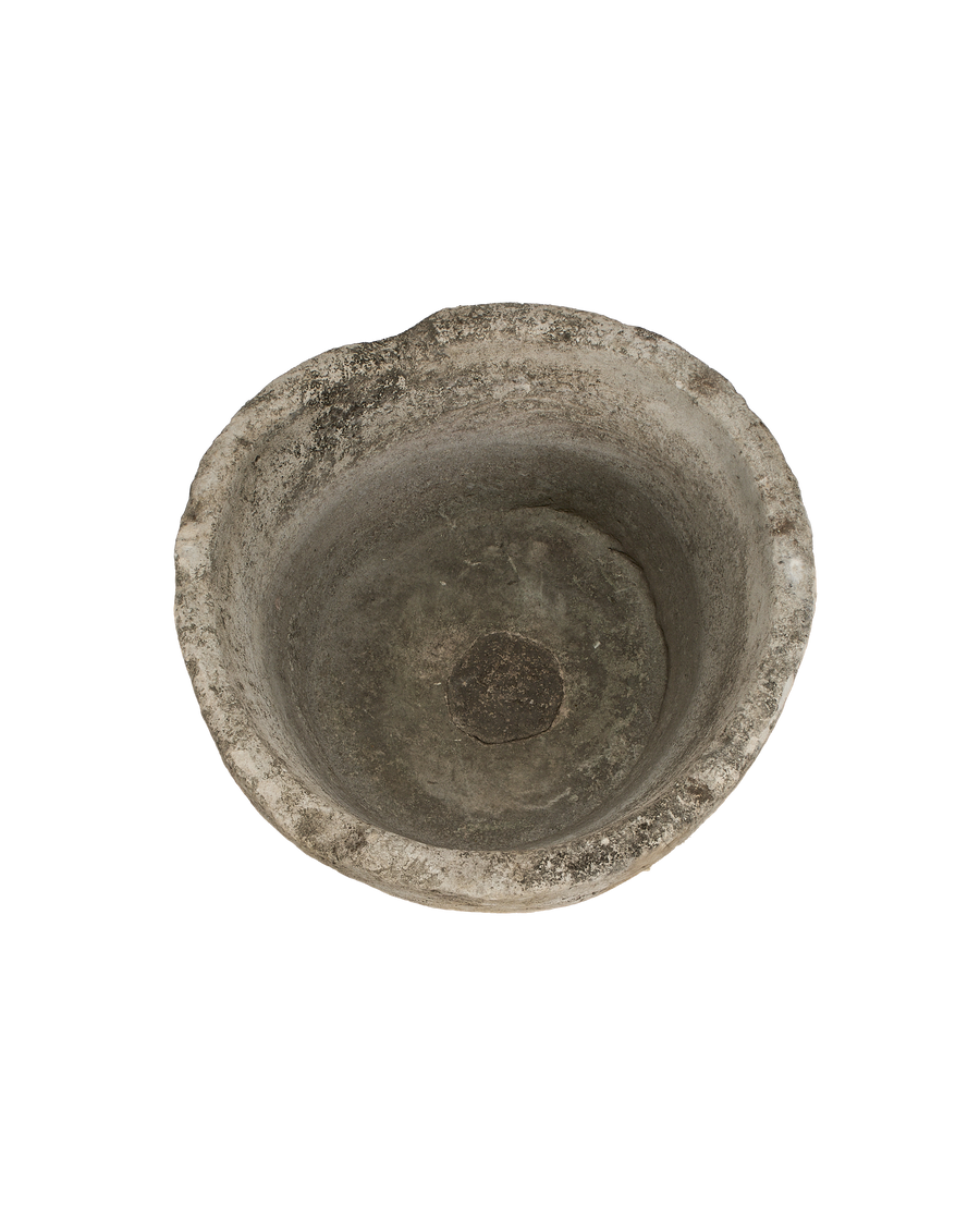 Vintage Indonesian round limestone trough, top-down view showing interior texture and worn rim.