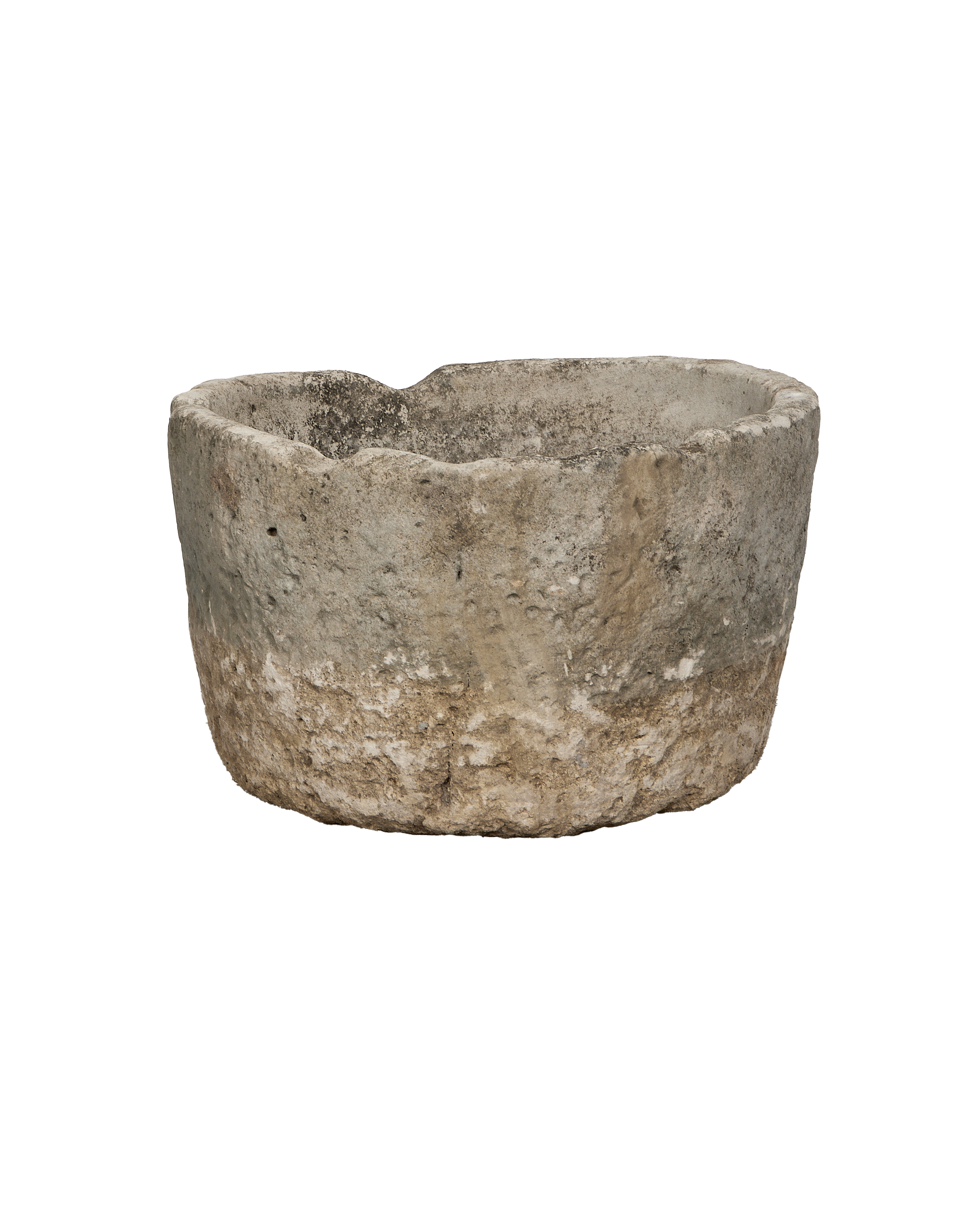 Vintage Indonesian round limestone trough, rough textured, weathered grey patina, front view.