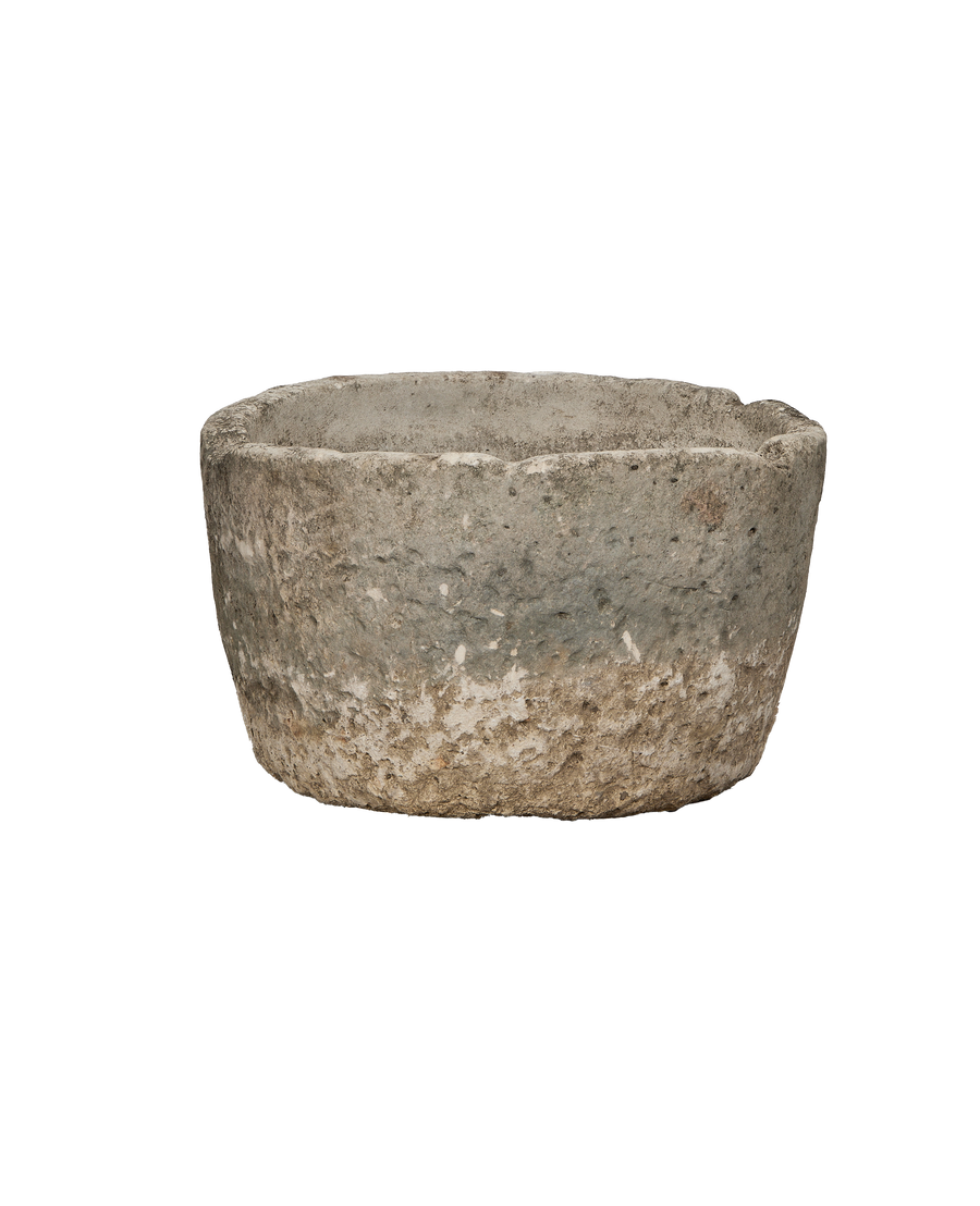 Vintage Indonesian limestone trough, round, showing detailed weathered surface condition.