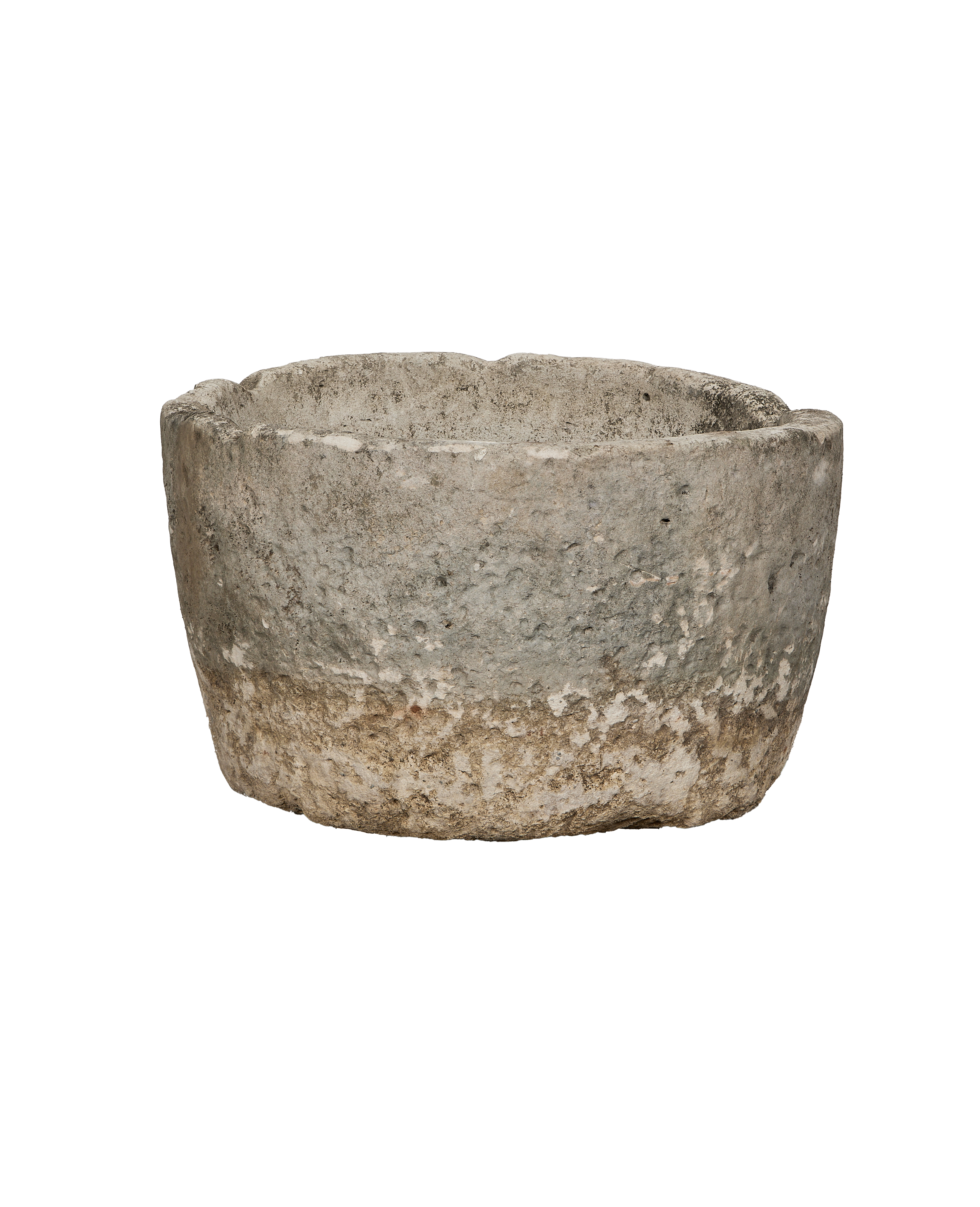 Vintage Indonesian limestone trough, showing rough textured exterior and weathered patina.