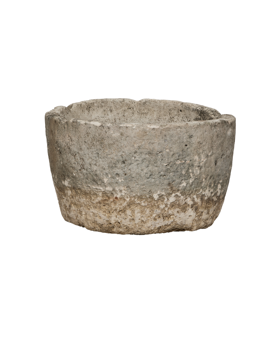 Vintage Indonesian limestone trough, showing rough textured exterior and weathered patina.