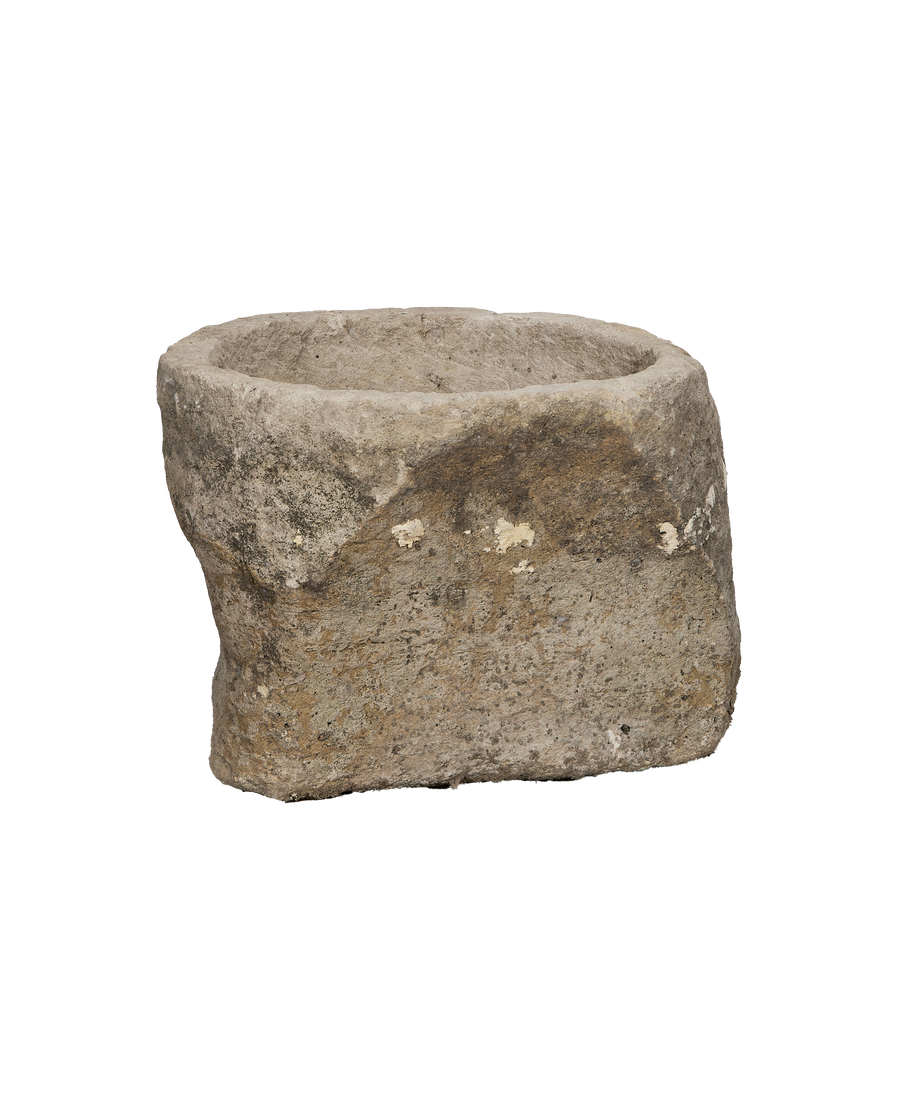 Vintage limestone trough from Indonesia, showing rough exterior and weathered surface details.