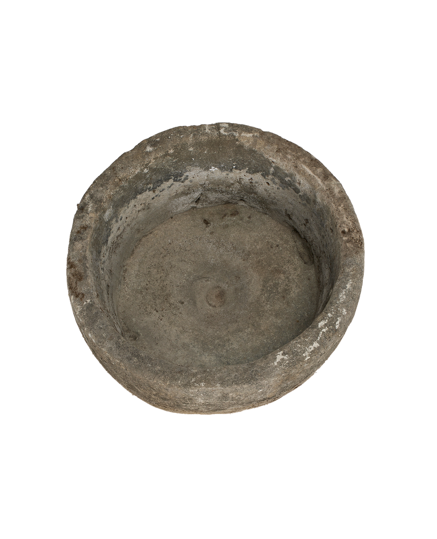 Vintage round Indonesian limestone trough, showing weathered interior details and unique imperfections from above.