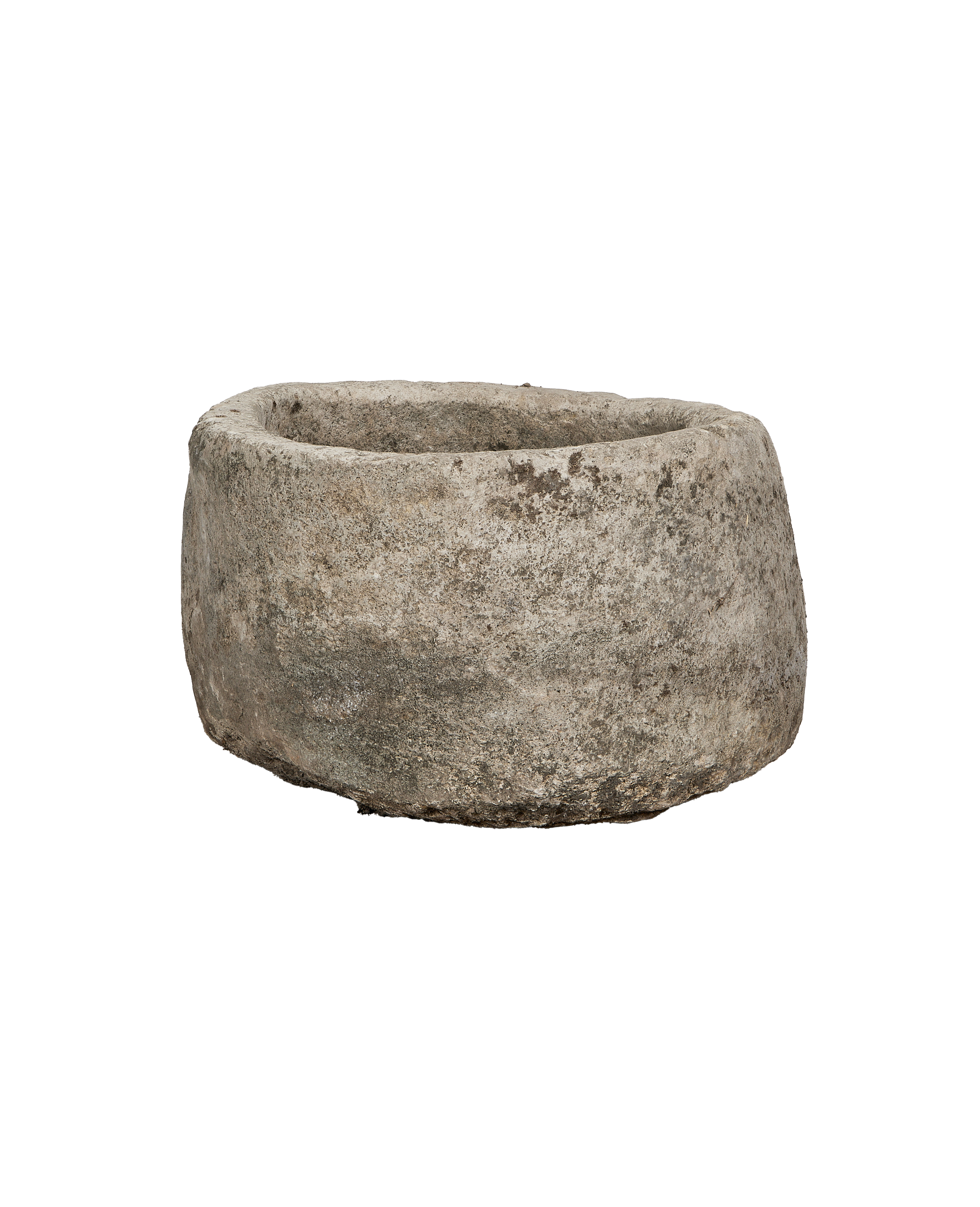 Vintage Indonesian round limestone trough, rough texture, weathered gray surface.