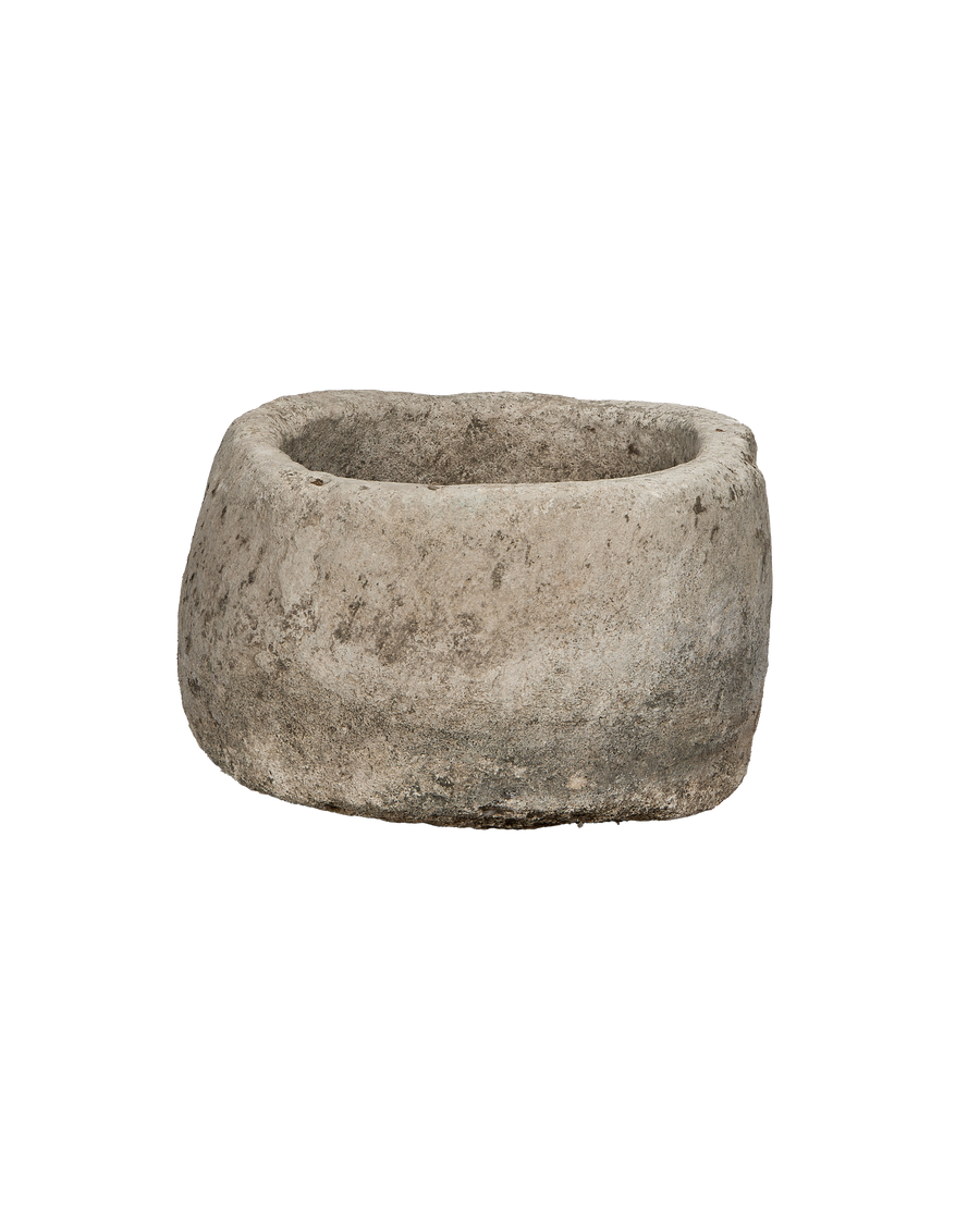 Vintage round Indonesian limestone trough, showing unique uneven texture and rustic patina.