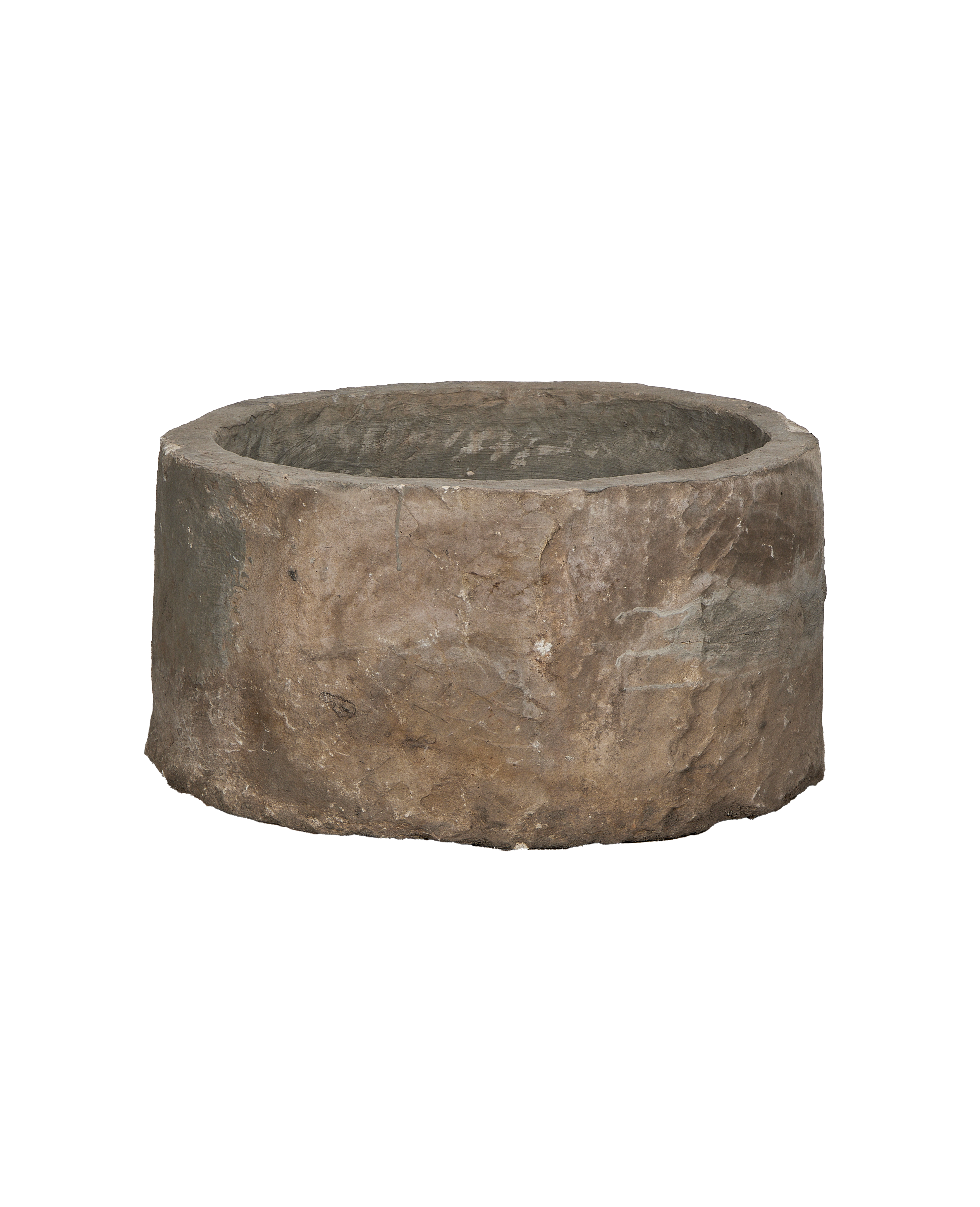 Vintage Indonesian round limestone trough, showing rough weathered exterior texture and condition.