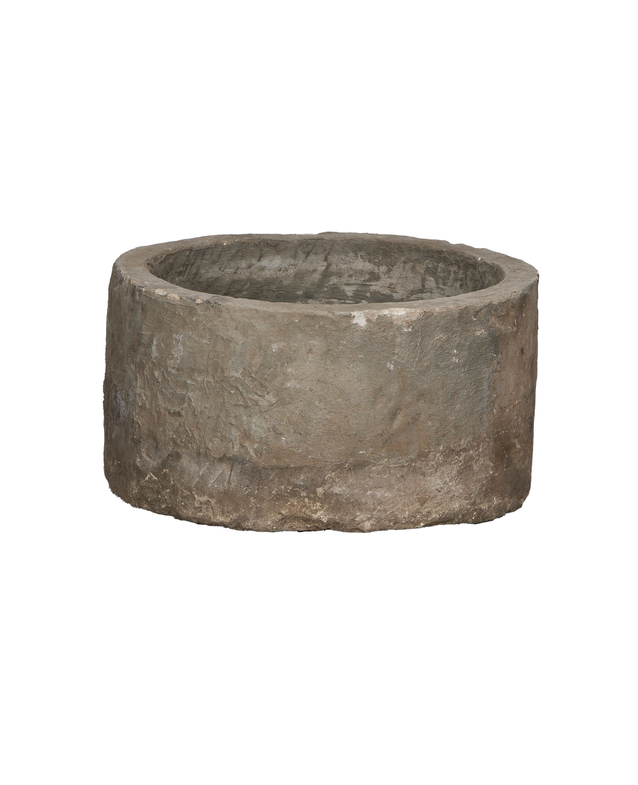 Vintage Indonesian limestone round trough from above, showing rough texture and weathered condition.