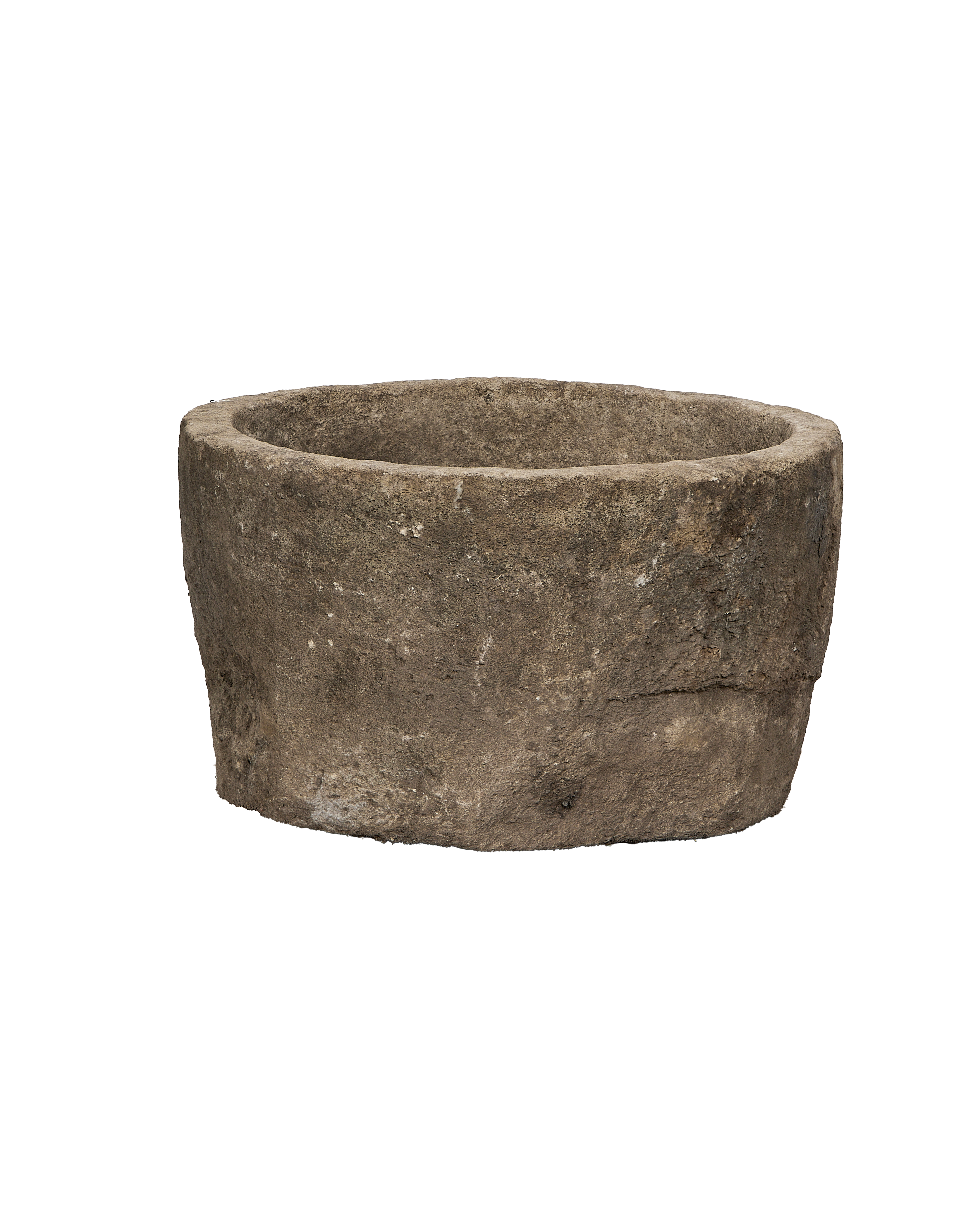 Vintage round Indonesian limestone trough, showing a shallow interior and rugged exterior texture.