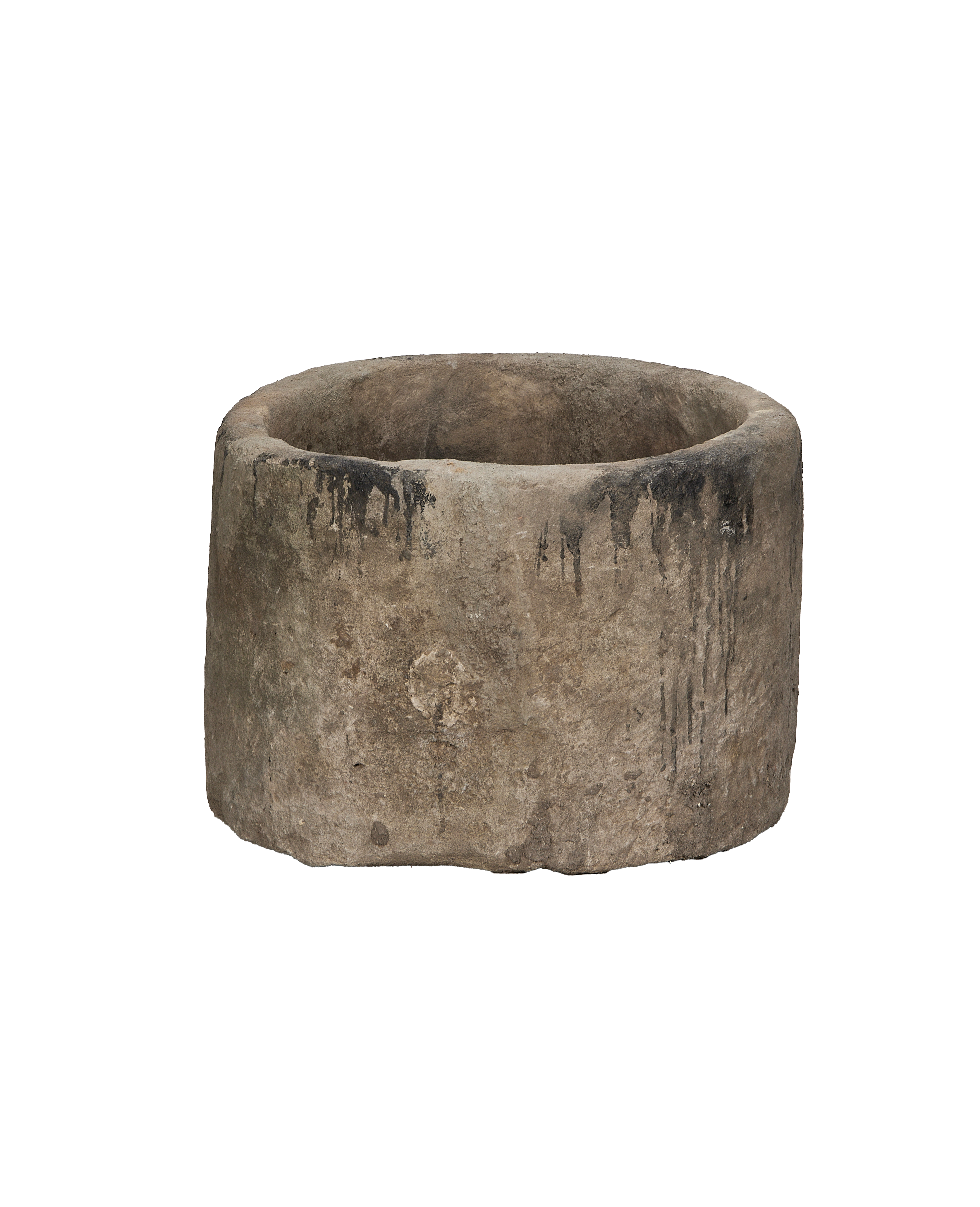 Vintage round limestone trough, side view revealing distressed surface and organic dark patina.
