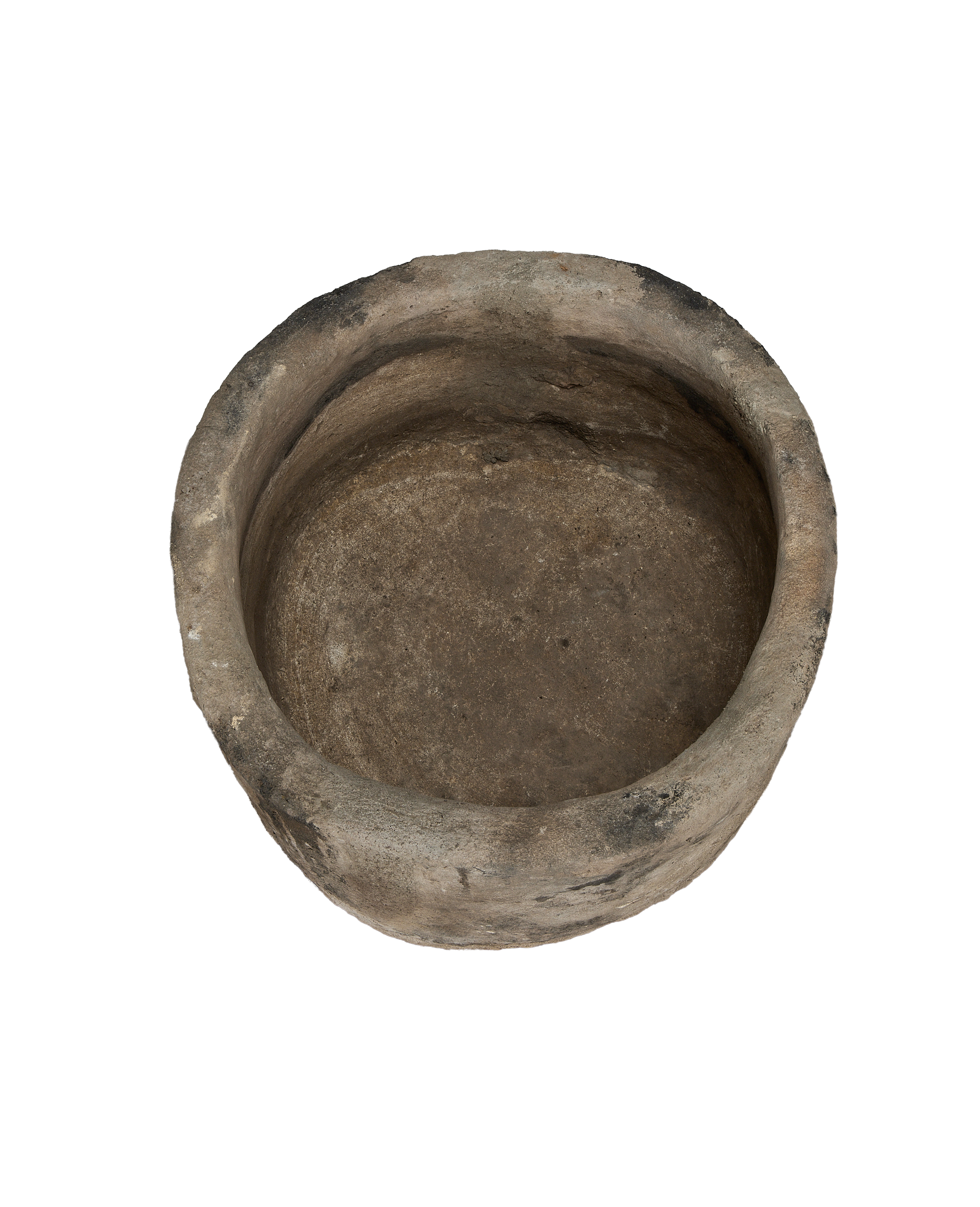 Vintage Indonesian round limestone trough, top-down view showing interior texture and aged patina.