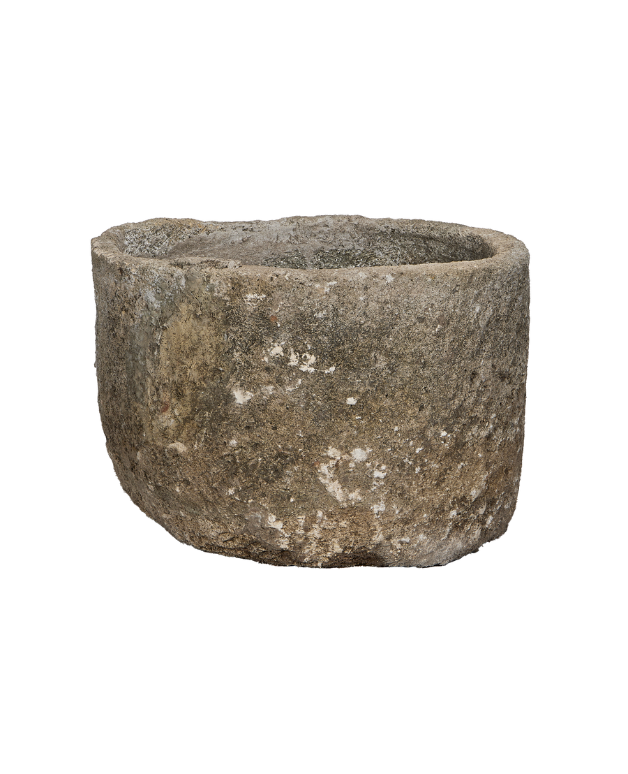 Vintage Indonesian round limestone trough, showing unique weathered exterior texture.