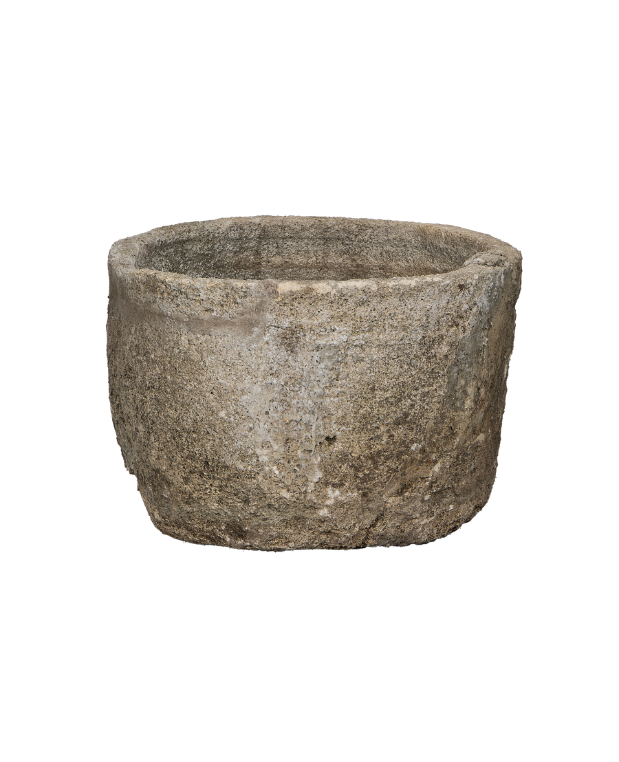 Vintage round Indonesian limestone trough, showing weathered side texture.