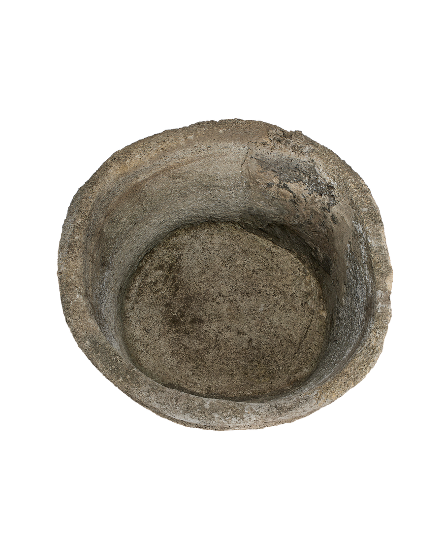 Vintage Indonesian limestone trough, top-down view showing weathered, textured interior.