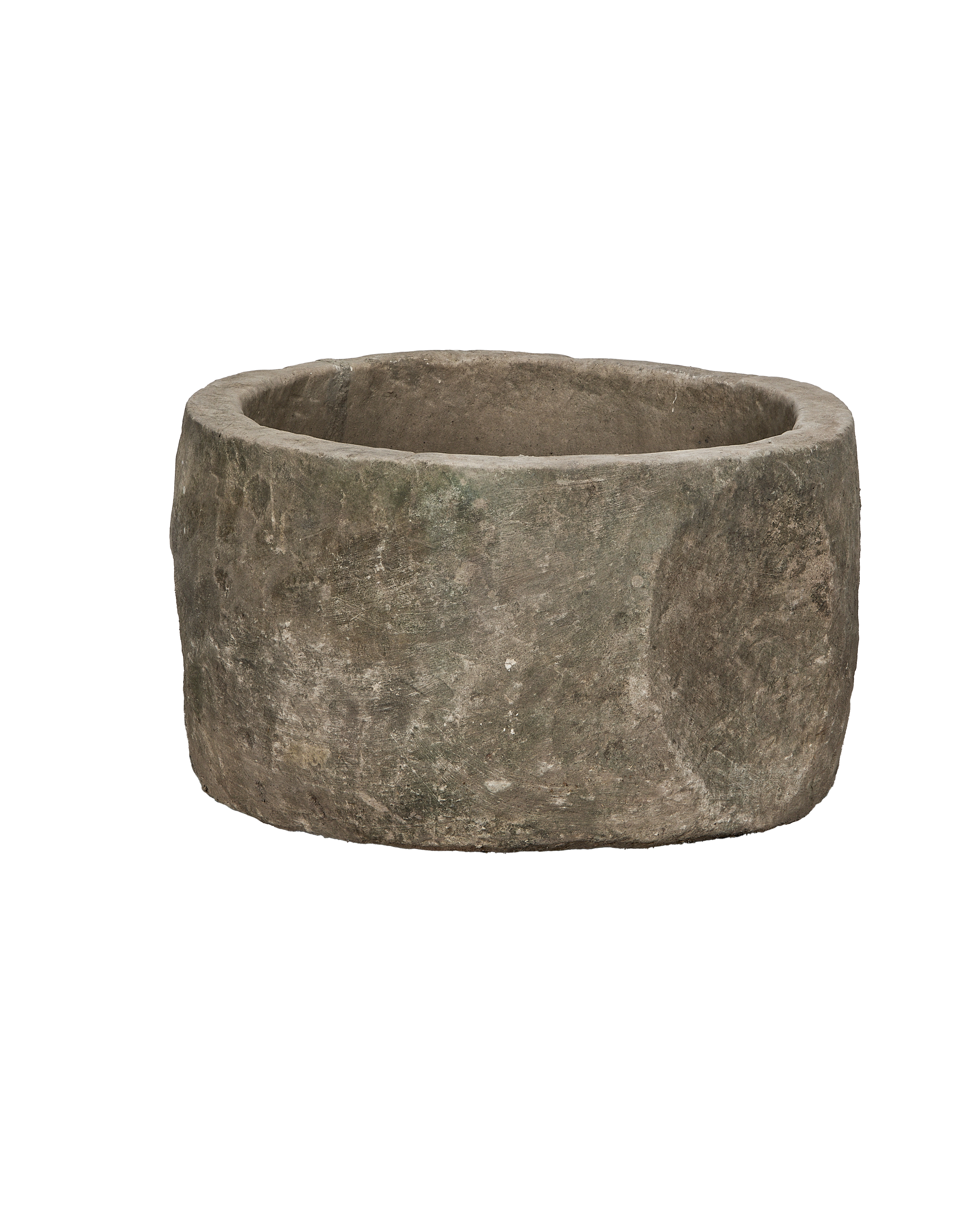 Vintage Indonesian round limestone trough, side angle with detailed aged texture and patina.