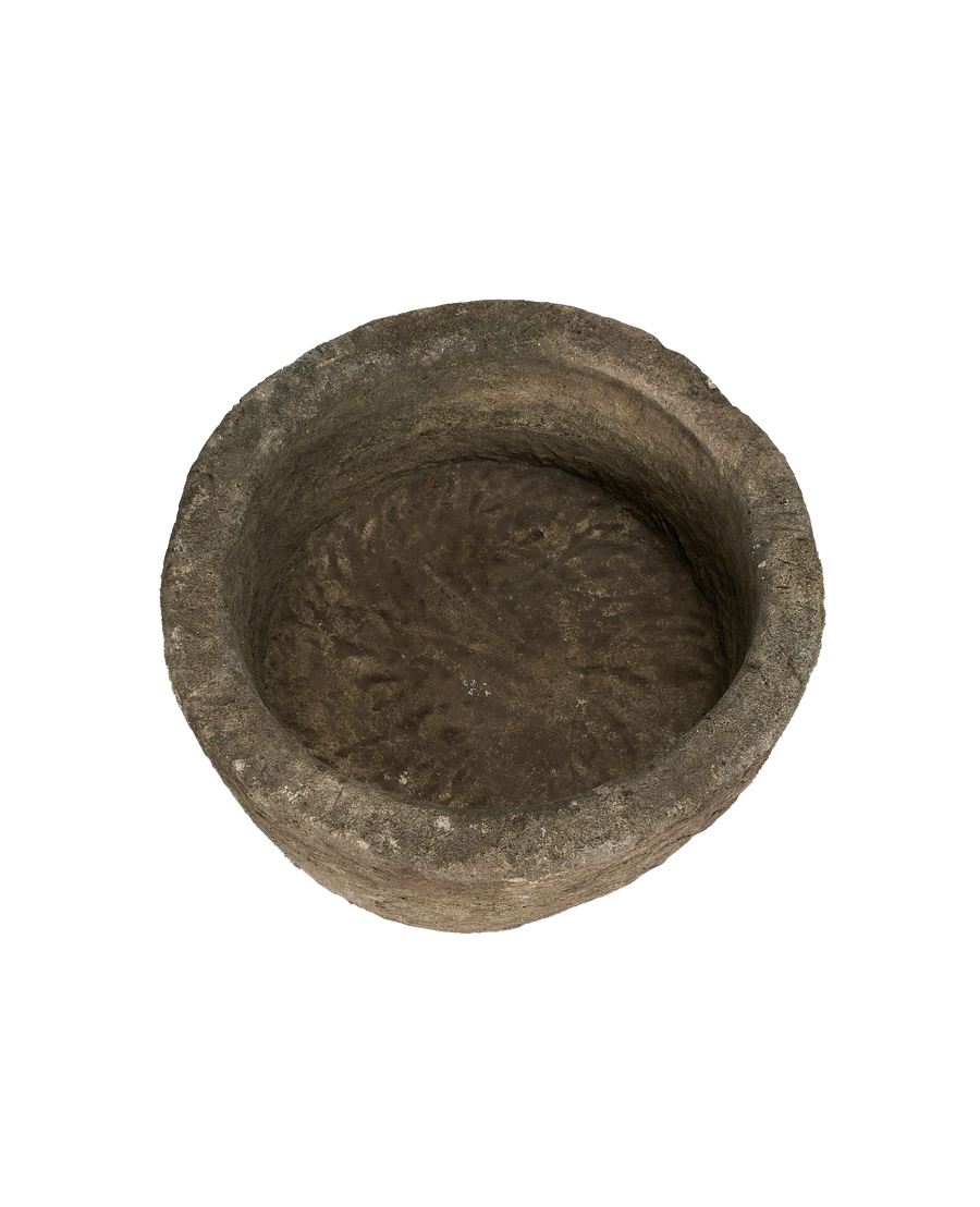 Vintage round Indonesian limestone trough, top view revealing rough interior texture and thick rim.